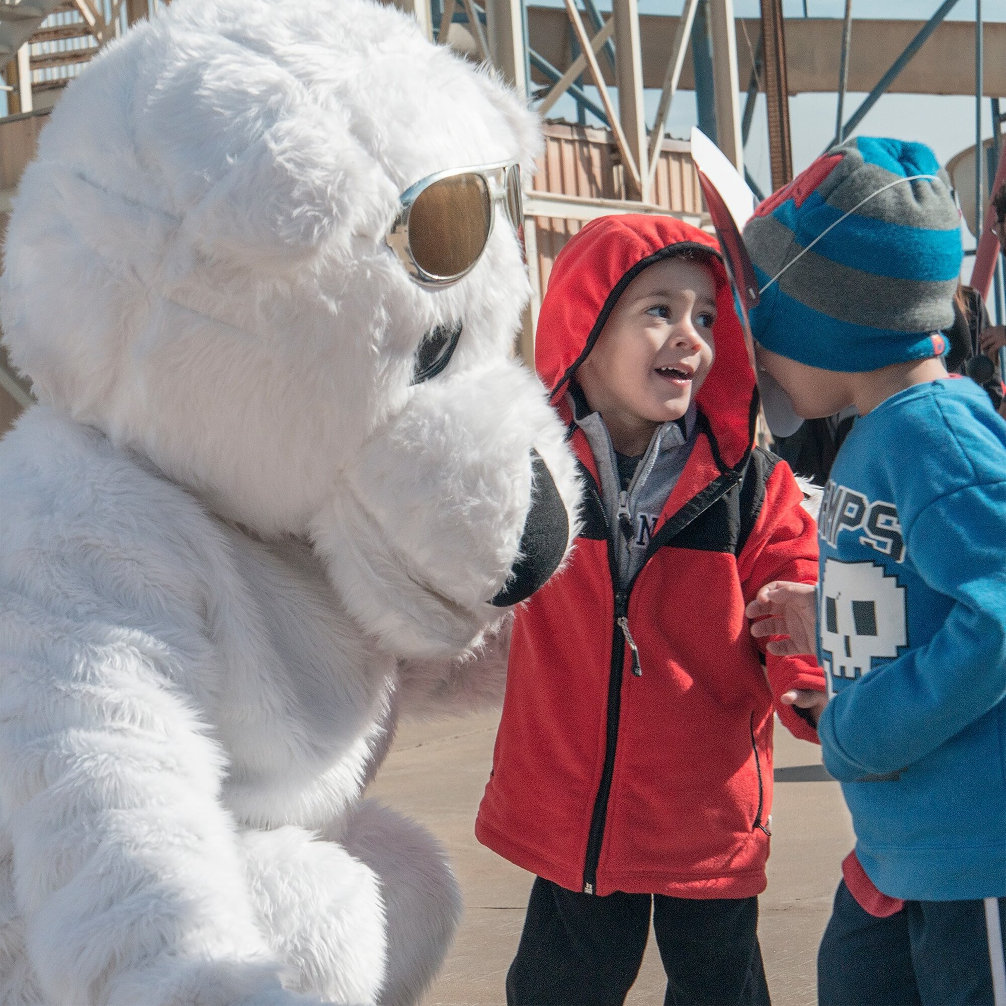 A costumed 1st Lt. Andrew Zwirlein, a 3rd Flying Training Squadron instructor pilot, pals around with some local kids at the 2015 Oklahoma Law Enforcement Polar Plunge in Enid, Oklahoma, Feb. 21, in support of Special Olympics Oklahoma. Vance Airmen volunteered and participated in the annual event in support of more than 10,000 athletes statewide. (U.S. Air Force photo / David Poe))