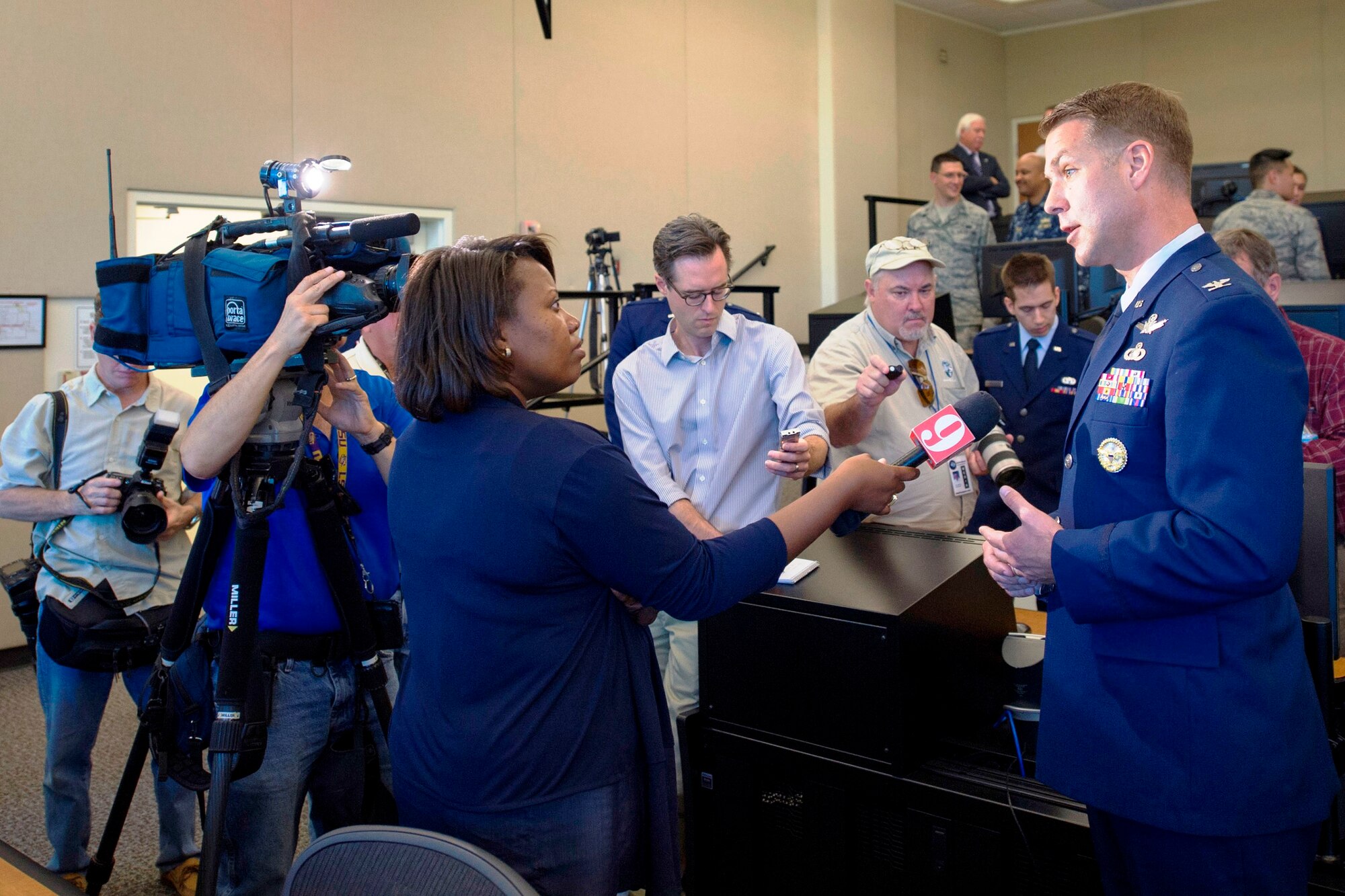 Col. Eric Krystkowiak, 45th Launch Group commander, conducts an interview with Melonie Holt of channel 9, following the Multi Vehicle Launch Support Center grand opening ceremony March 4, 2015, at the 45th Space Wing's Headquarters building at Cape Canaveral Air Force Station, Fla. The renovated center is now equipped with 30 computers, 60 monitors, six projection screens and countdown clocks to provide video and data during launch countdowns.  (U.S. Air Force photo/Matthew Jurgens) (Released) 
