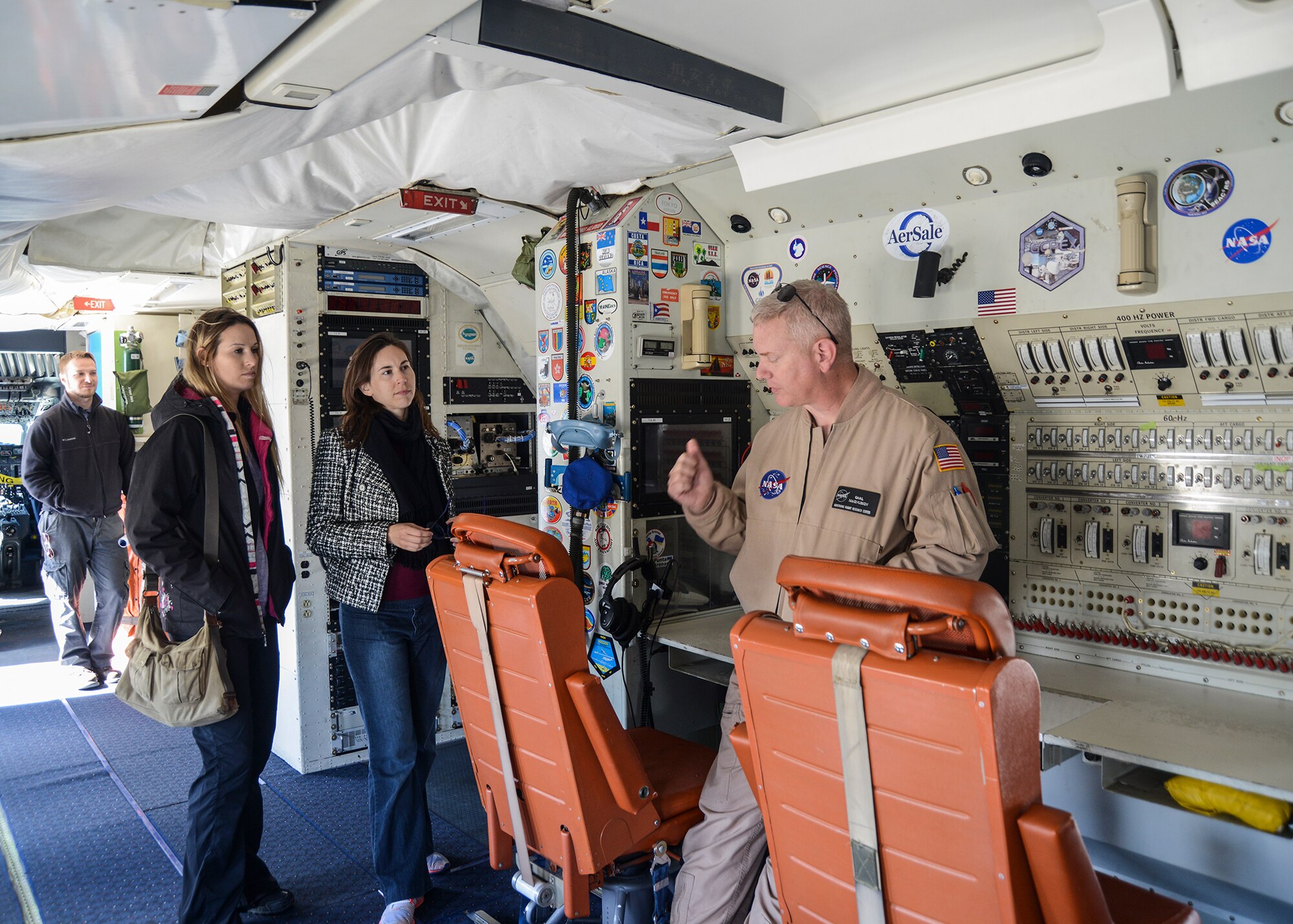 NASA employee Carl Magnusson explains how the NASA DC-8 is used for the airborne science research program. (U.S. Air Force photo by Rebecca Amber)