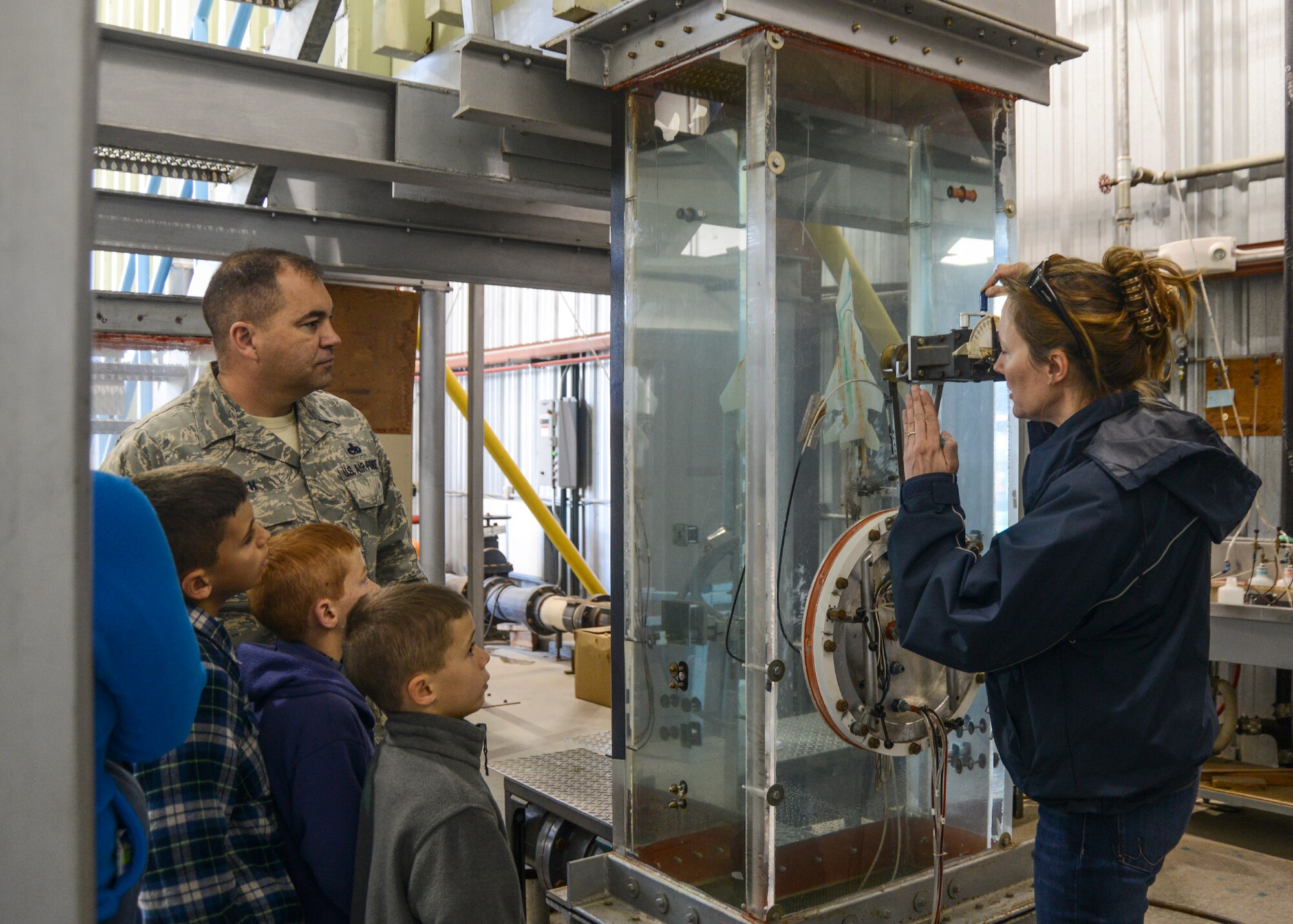 At the NASA Armstrong Flight Research Center SALUTE event March 2, dozens of displays were put on to teach visitors and children about the NASA mission and science. In the flow visualization facility a model aircraft is placed in a water tunnel to observe how the water will flow around the structure of an aircraft. (U.S. Air Force photo by Rebecca Amber)