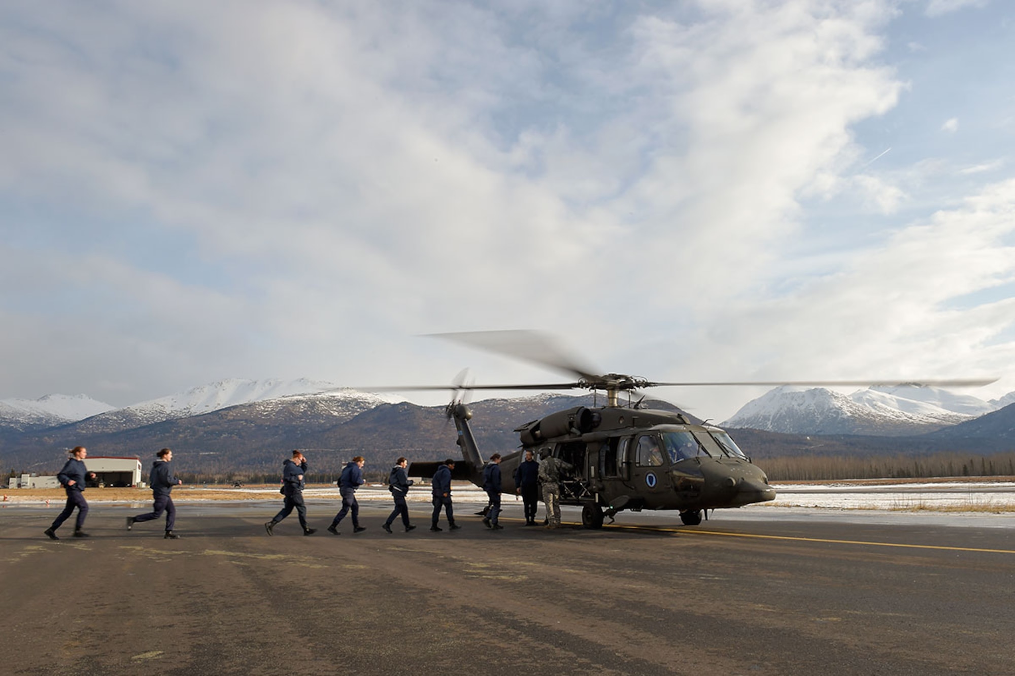 Alaska Military Youth Academy cadets board an Alaska Army National Guard UH-60 Black Hawk helicopter assigned to 1st Battalion, 207th Aviation Regiment on Joint Base Elmendorf-Richardson, Alaska, Feb. 24, 2015. The Alaska Army National Guard participated in the AMYA outreach program to expose the cadets to military life. (U.S. Air Force photo/Alejandro Pena)