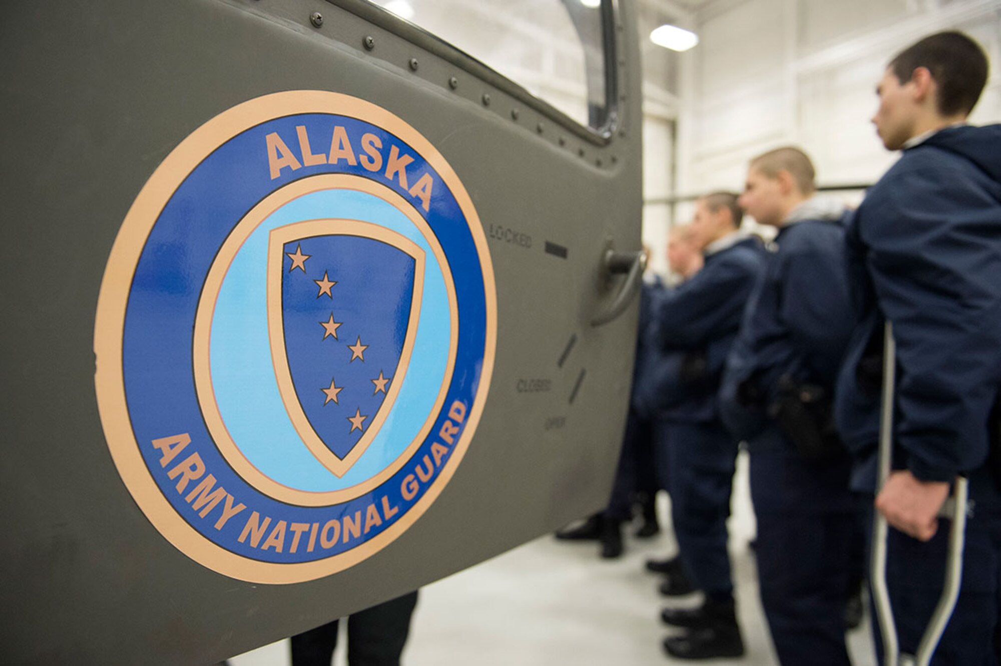 Alaska Military Youth Academy cadets familiarize themselves with an Alaska Army National Guard UH-60 Black Hawk helicopter assigned to 1st Battalion, 507th Aviation Regiment on Joint Base Elmendorf-Richardson, Alaska, Feb. 24, 2015. The Alaska Army National Guard participated in the AMYA outreach program to expose the cadets to military life. (U.S. Air Force photo/Alejandro Pena)