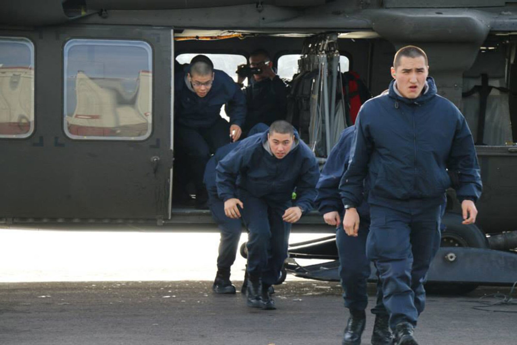 Rafael Vicens and others cadets of the National Guard Alaska Military Youth Academy exit a UH-60 Black Hawk helicopter on Joint Base Elmendorf-Richardson, Alaska, Feb. 24. “This place is great,” Vicens said. “I've met my expectations.” (Courtesy photo)