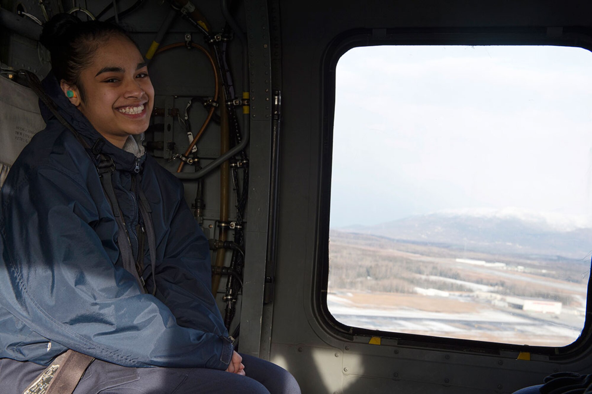 Alaska Military Youth Academy Cadet Viandralyne Andon, an Anchorage native, rides in an Alaska Army National Guard UH-60 Black Hawk helicopter assigned to 1st Battalion, 507th Aviation Regiment on Joint Base Elmendorf-Richardson, Alaska, Feb. 24, 2015. The Alaska Army National Guard participated in the AMYA outreach program to expose the cadets to military life. (U.S. Air Force photo/Alejandro Pena)