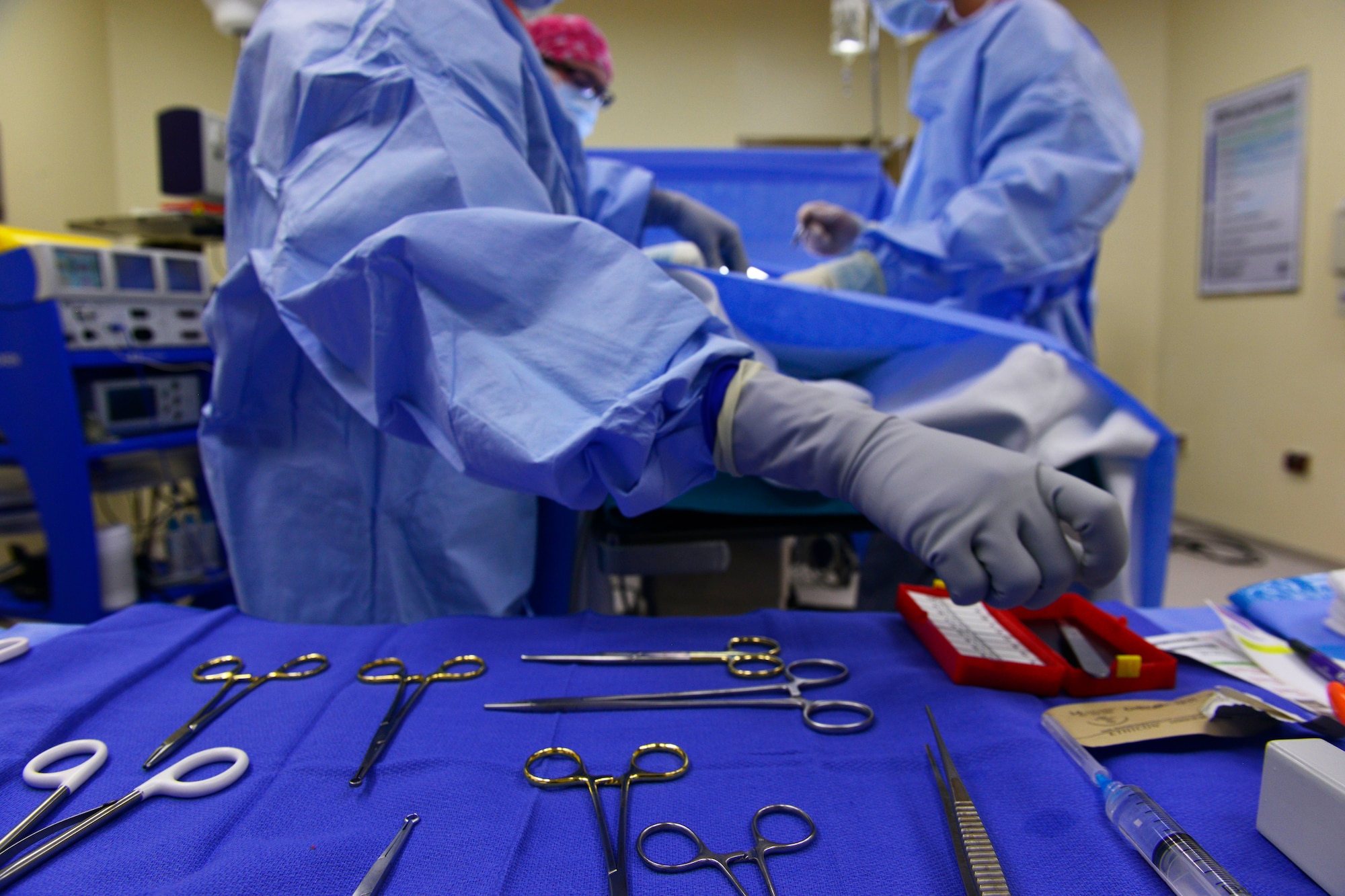 U.S. Senior Airman Sylvia Coon, 31st Surgical Operations Squadron surgery technician, reaches for a syringe during a surgery, March 4, 2015, at Aviano Air Base, Italy. The 31st SGC offers surgical specialty care in support of the primary care mission to ensure a deployable fighting force. (U.S. Air Force photo by Airman 1st Class Ryan Conroy/Released)