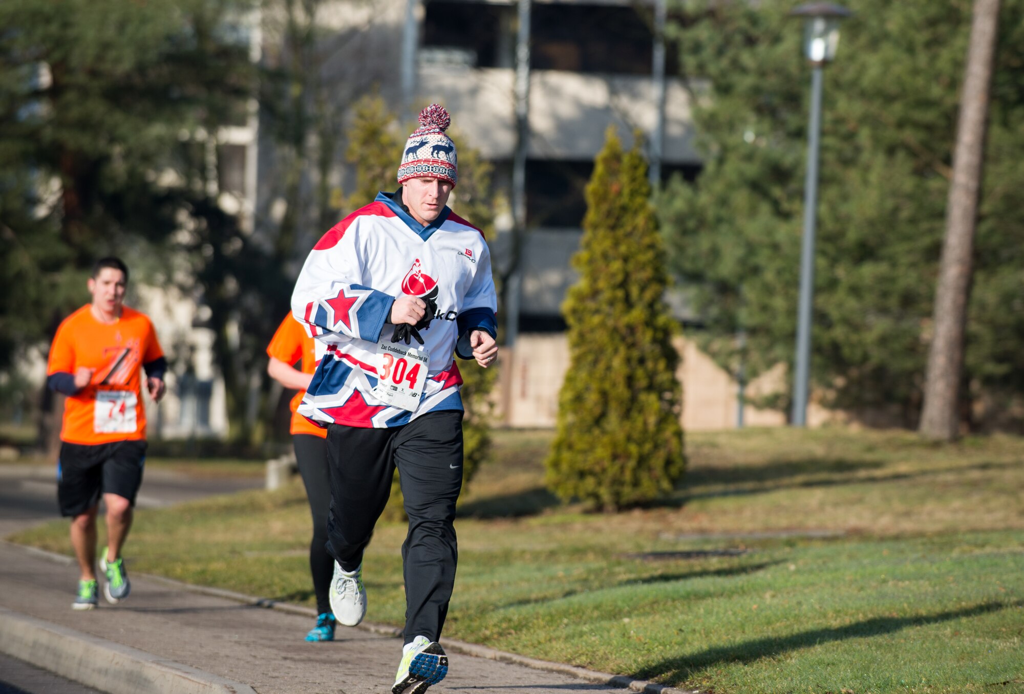 Army Capt. James Koehler, Baumholder Dental Clinic general dentist, runs in the fourth annual A1C Zachary Cuddeback Memorial 5k run at Ramstein Air Base, Germany, Feb. 28, 2015. Cuddeback was a member of the Eagles hockey team, and the team has ran in every run since his passing. (U.S. Air Force photo/Staff Sgt. Armando A. Schwier-Morales)