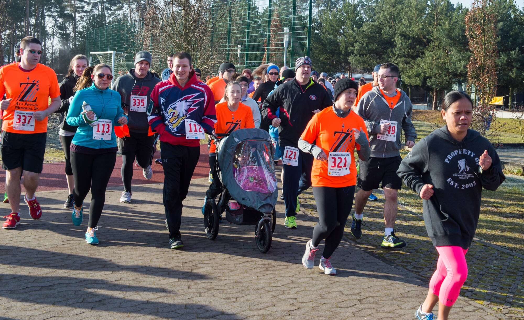 Members of the Kaiserslautern Military Community run in a five kilometer run in memory of Zachary Cuddeback at Ramstein Air Base, Germany, Feb. 28, 2015. Cuddeback was one of several servicemembers killed during a terrorist attack at Frankfurt Airport, Germany. (U.S. Air Force photo/Staff Sgt. Armando A. Schwier-Morales)