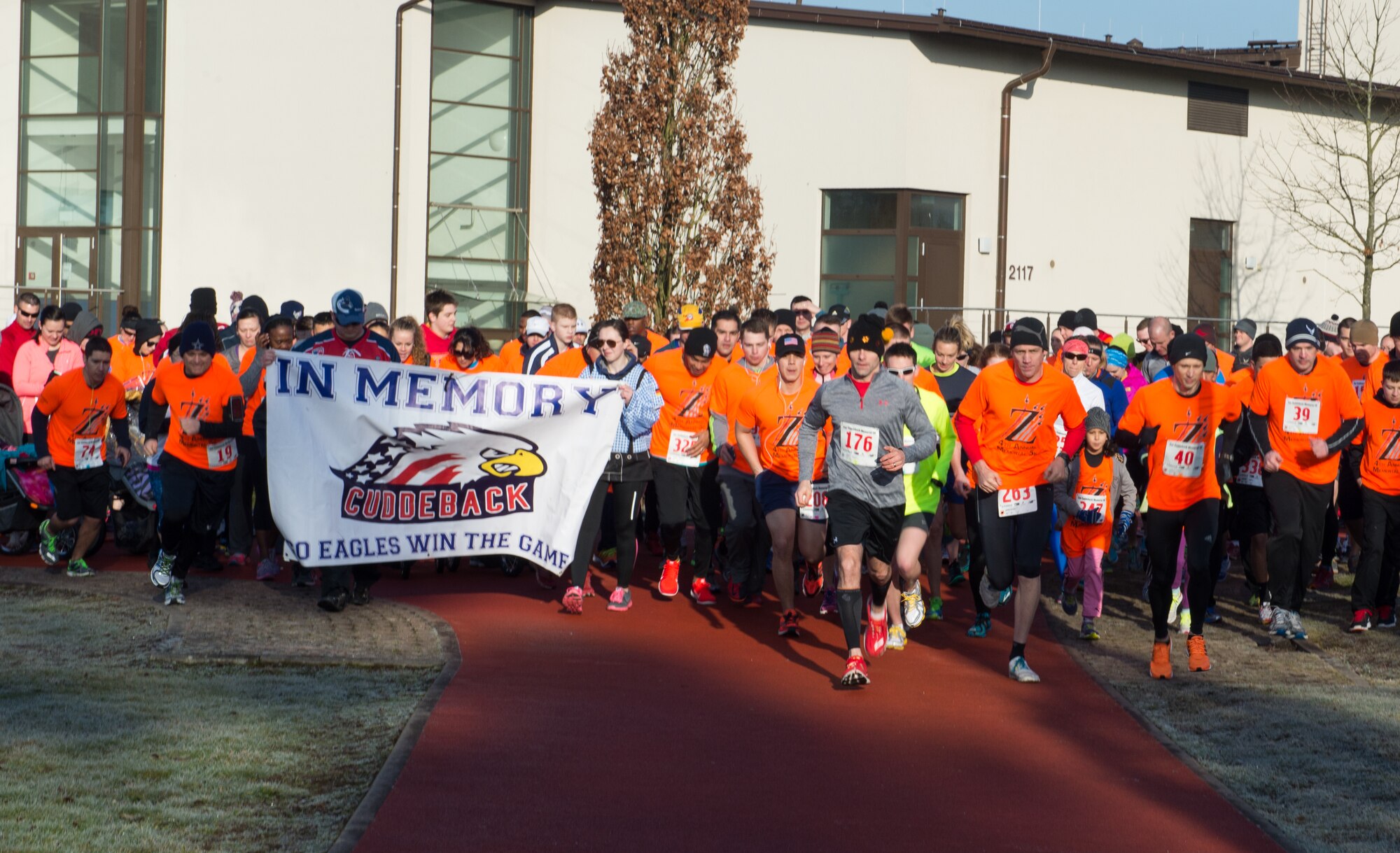 Runners take off, commencing the fourth annual A1C Zachary Cuddeback Memorial 5k run at Ramstein Air Base, Germany, Feb. 28, 2015. After Cuddeback was killed in a terrorist attack, members of his squadron have hosted a memorial run in his honor. (U.S. Air Force photo/Staff Sgt. Armando A. Schwier-Morales)