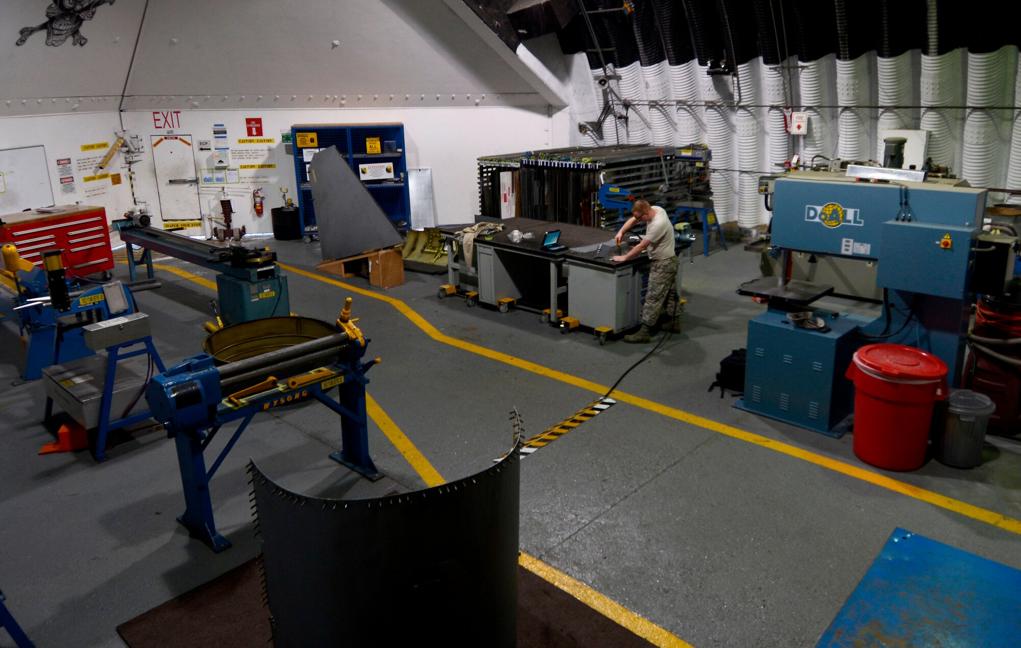 U.S. Air Force Tech. Sgt. Jeremy Ryan, 31st Maintenance Squadron aircraft structural maintenance craftsman, drills holes into an F-16 Fighting Falcon flap panel, March 4, 2015 at Aviano Air Base, Italy. Aircraft structural maintenance Airmen perform fabrication, structural repairs and modifications for all aircraft. (U.S. Air Force photo by Senior Airman Areca T. Wilson/Released)