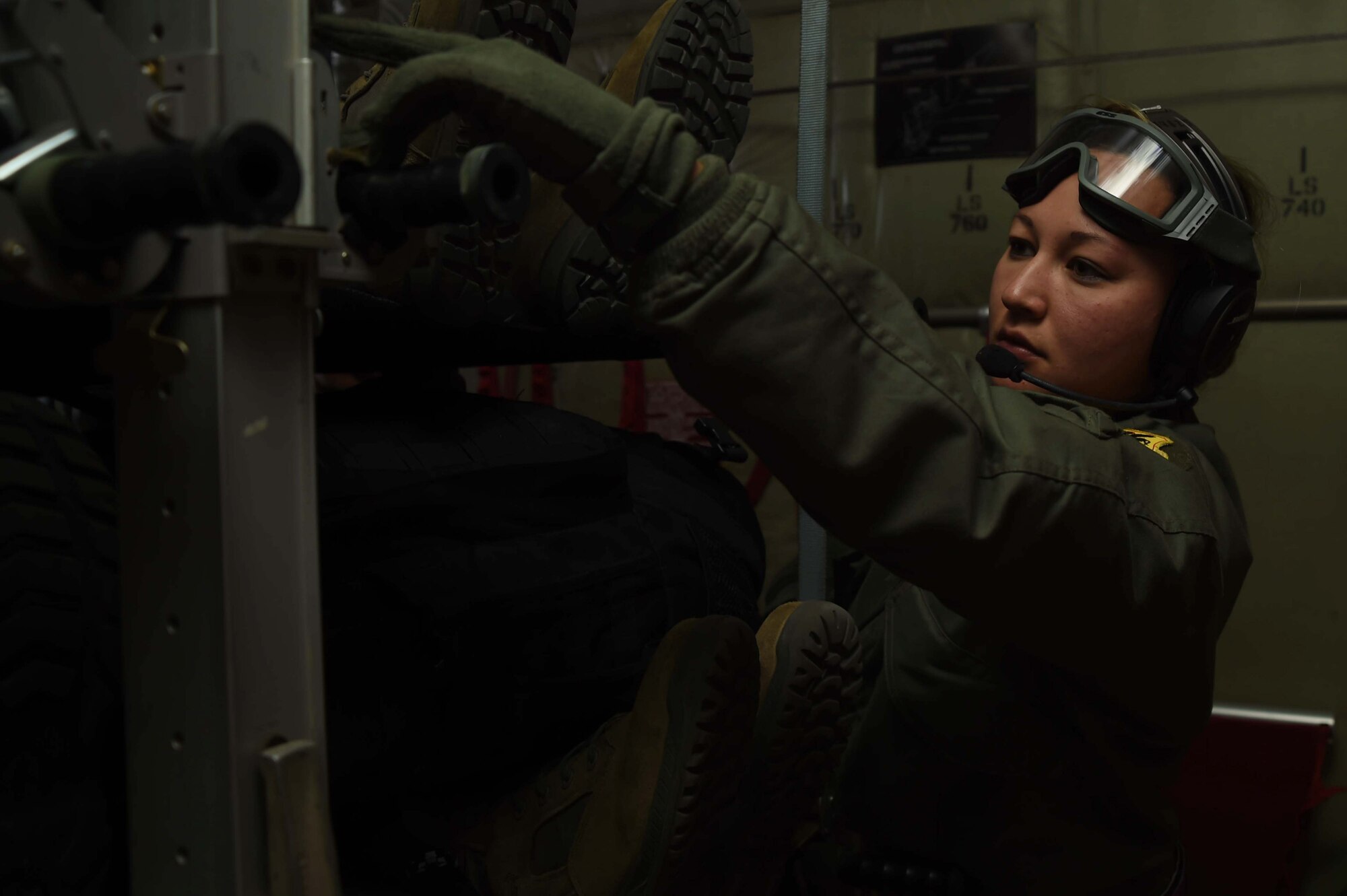 U.S. Air Force Staff Sgt. Vanessa Potchebski, 18th Aeromedical Evacuation Squadron aeromedical technician, checks on an Airman lying on a litter inside a C-130J Hercules at Misawa Air Base, Japan, March 5, 2015. Potchebski is one of several 18 AES Airmen from Kadena Air Base, Japan, who participated in an aeromedical evacuation scenario as part of operational readiness exercise Beverly Sunrise 15-2 at Misawa. (U.S. Air Force photo by Staff Sgt. Alyssa C. Wallace/Released)