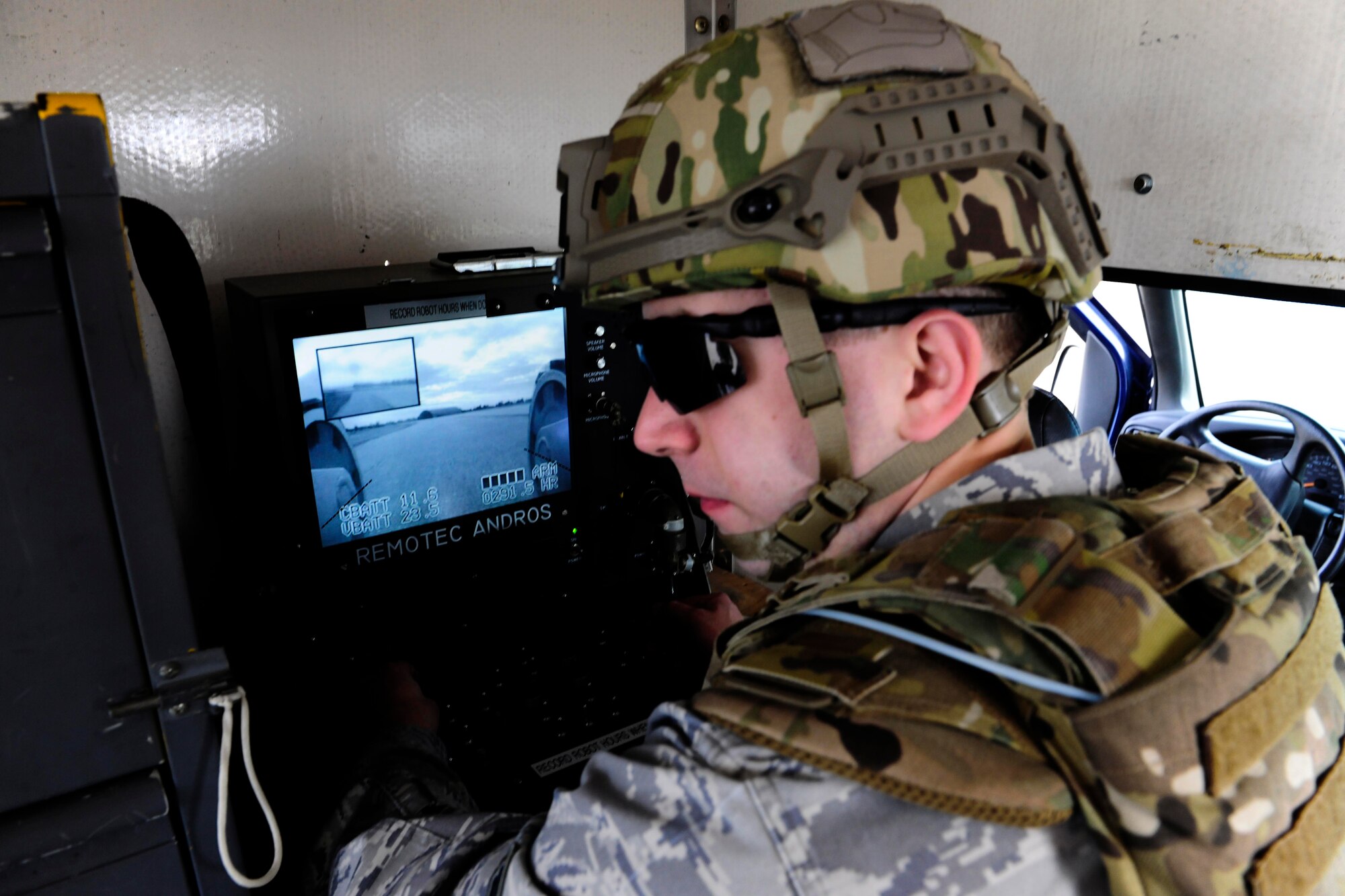 Senior Airman Chad Barber, 39th Civil Engineer Squadron explosive ordinance disposal technician, pilots an unmanned remote robot Feb. 25, 2015, at Incirlik Air Base, Turkey. The robot, allows the EOD members to investigate a suspicious package from a safe distance. (U.S. Air Force photo by Senior Airman Krystal Ardrey/Released)