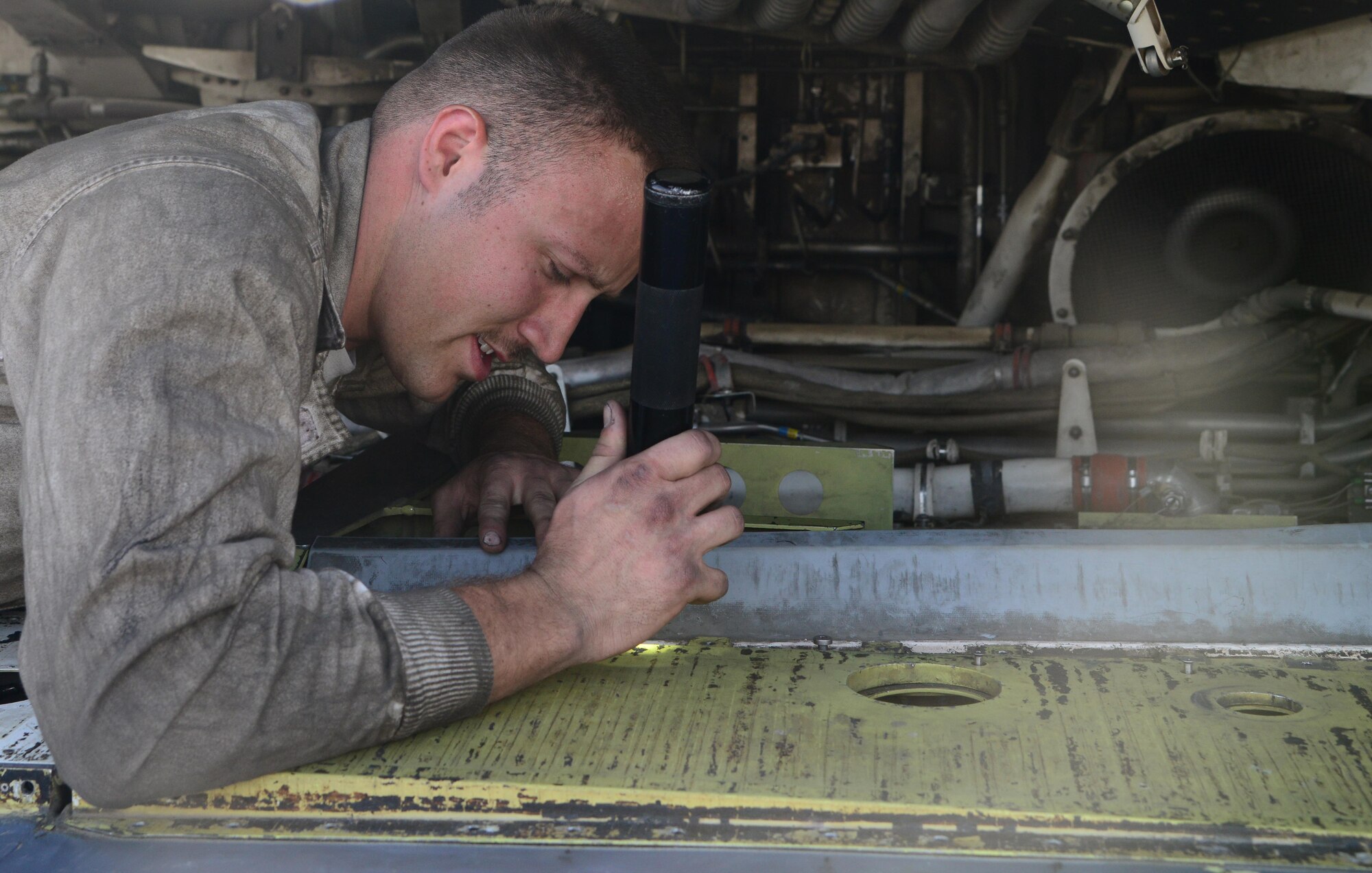 U.S. Air Force Senior Airman Cody Patterson, 34th Expeditionary Aircraft Maintenance Unit, works on an over-wing fairing on a B-1B Lancer, March 1, 2015, at Al Udeid Air Base, Qatar. Patterson, a native of Marion, Va., deployed here from Ellsworth Air Force Base, S.D., is a dedicated crew chief of the 34th Expeditionary Bomb Squadron flagship. With the B-1s ever-increasing role in combat operations pushing the airframe to the limits of its original design, skilled maintenance professionals are crucial to ensuring mission success. (U.S. Air Force photo by Senior Airman Kia Atkins)