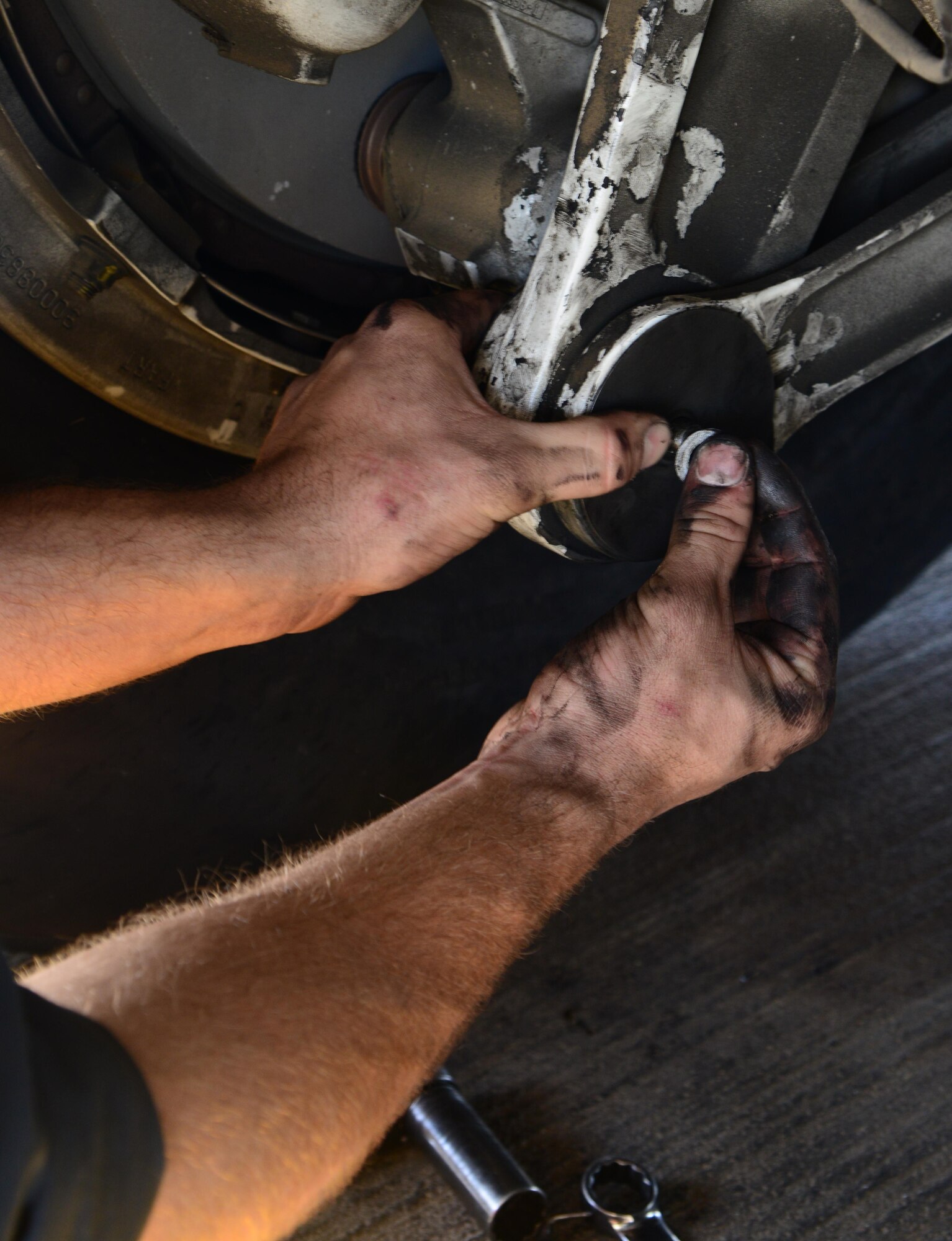 U.S. Air Force Senior Airman Cody Patterson, 34th Expeditionary Aircraft Maintenance Unit, installs a brake torque link retaining pin on a B-1B Lancer, March 1, 2015, at Al Udeid Air Base, Qatar. Patterson, a native of Marion, Va., deployed here from Ellsworth Air Force Base, S.D., is a dedicated crew chief of the 34th Expeditionary Bomb Squadron flagship. Carrying the largest payload of both guided and unguided weapons in the Air Force inventory, the multi-mission B-1B Lancer is the backbone of America's long-range bomber force and is a key resource for strike operations throughout U.S. Central Command’s Area of Responsibility. (U.S. Air Force photo by Senior Airman Kia Atkins)