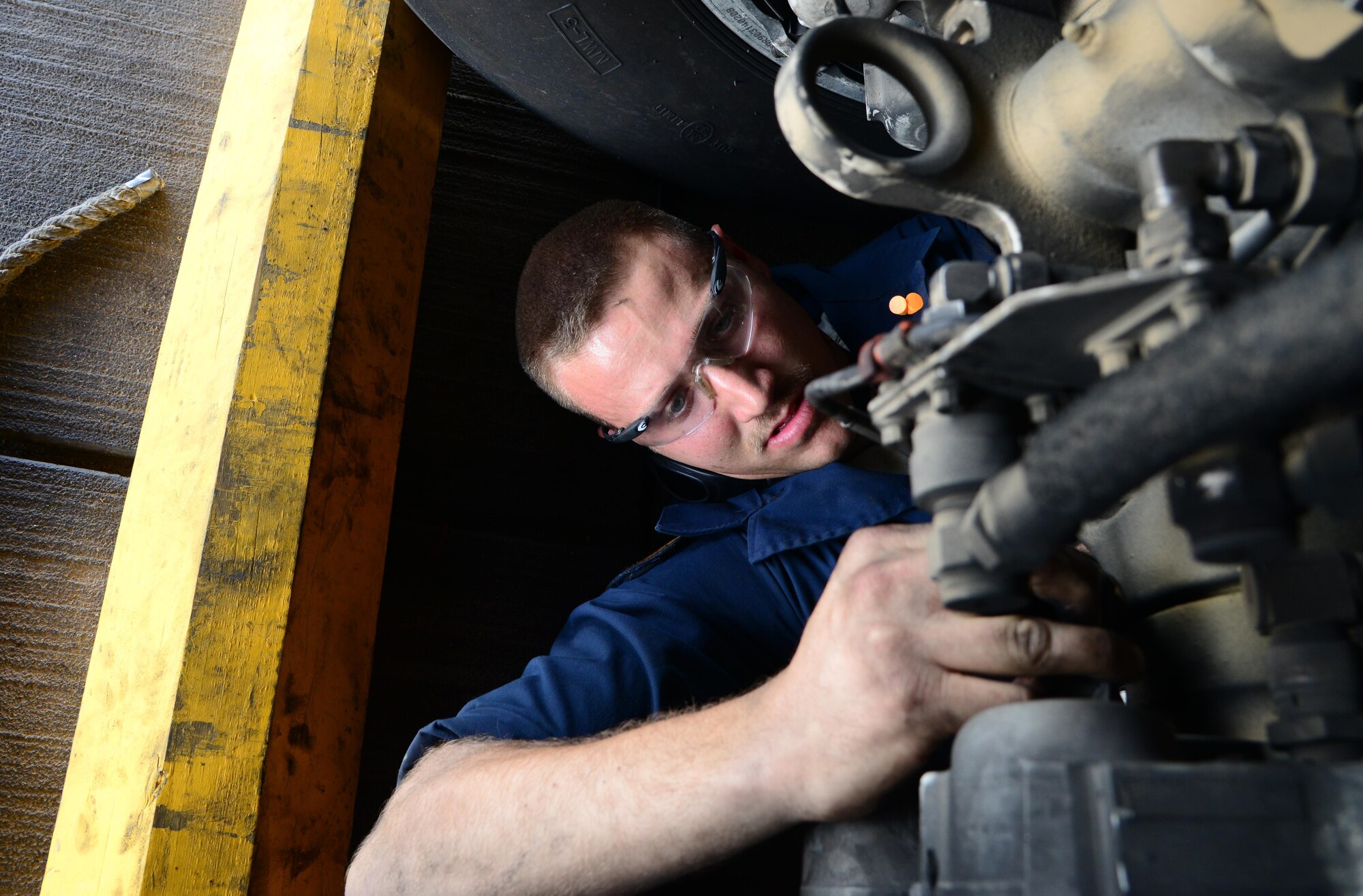 U.S. Air Force Senior Airman Cody Patterson, 34th Expeditionary Aircraft Maintenance Unit, performs a main landing gear temperature sensor inspection, March 1, 2015, at Al Udeid Air Base, Qatar. Patterson, a native of Marion, Va., deployed here from Ellsworth Air Force Base, S.D., is a dedicated crew chief of the 34th Expeditionary Bomb Squadron flagship. B-1s based here are capable of supporting operations in Iraq, Syria, Afghanistan, or anywhere else they are needed. In recent months, the bombers have played a major role in helping Iraqi and Kurdish forces hold or retake key territory in Iraq and Syria, as well as destroying facilities and assets used by the Islamic State of Iraq and the Levant. (U.S. Air Force photo by Senior Airman Kia Atkins)