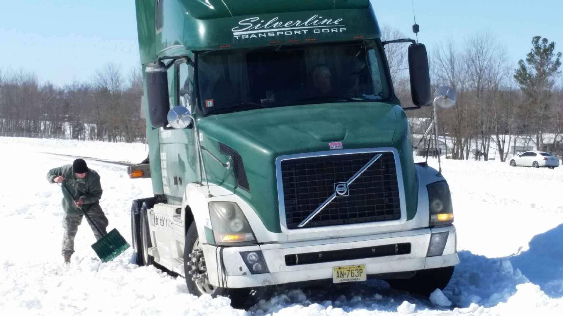 Staff Sgt. Steve Musgrave assists a truck driver along I-24 in McCracken County, Kentucky. Musgrave is one of the Soldiers from the Kentucky National Guard's Co. A, 149th Brigade Support Battalion deployed as part of Task Force West assisting motorists stranded during Winter Storm Thor.