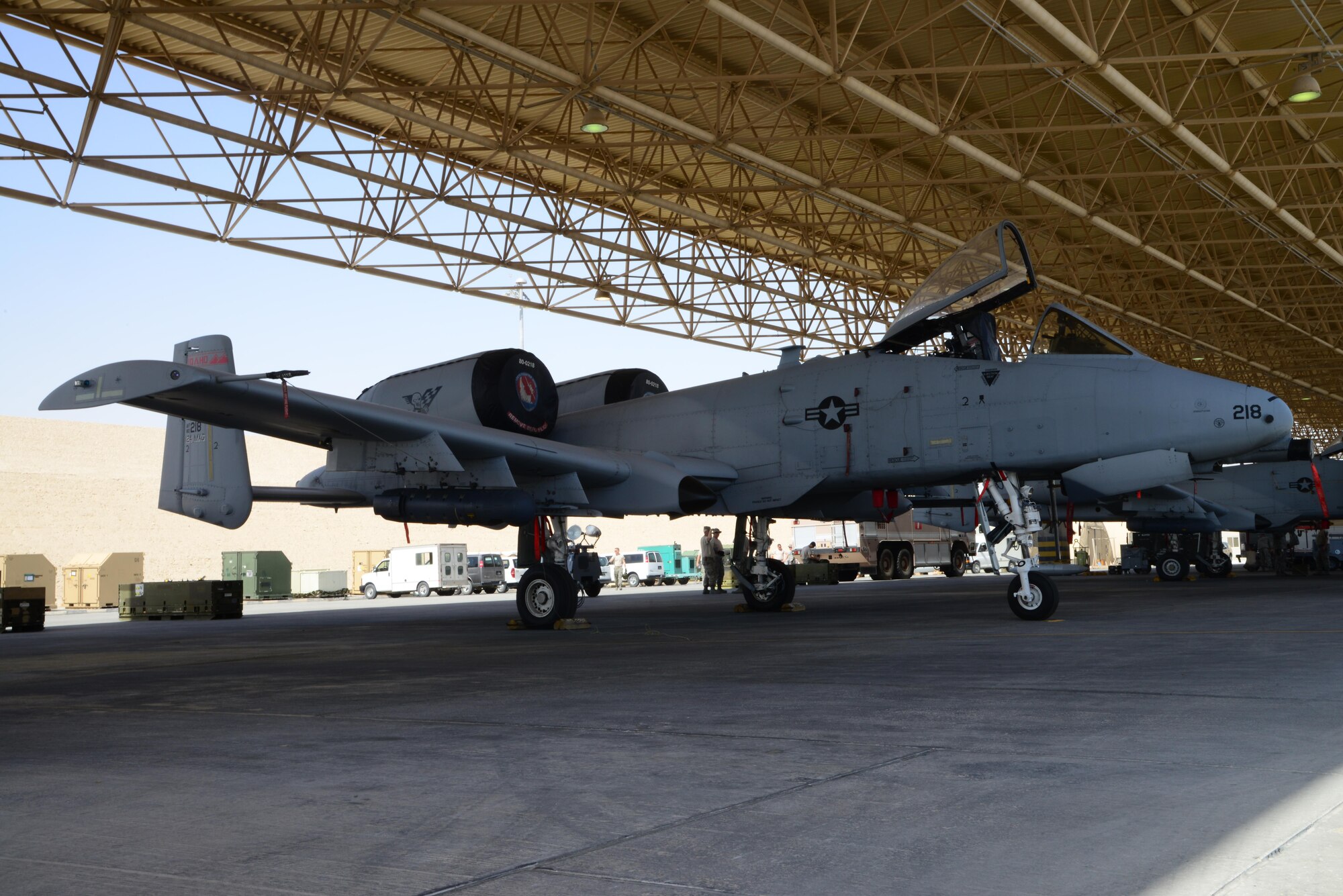 An A-10 Thunderbolt is parked underneath a sunshade, March 2, 2015, at Al Udeid Air Base, Qatar. A contingent of six A-10 Thunderbolts and more than 120 personnel assigned to the 190th Expeditionary Fighter Squadron recently arrived here to participate in three major coalition exercises in the region. (U.S. Air Force photo by Senior Airman Kia Atkins)