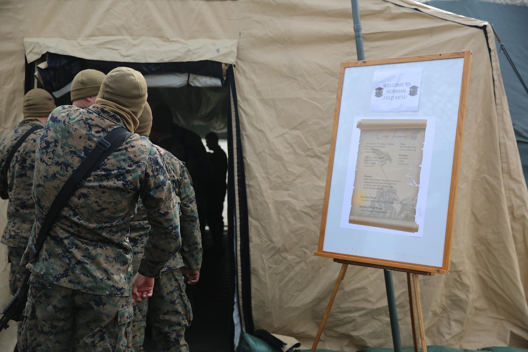 Marines stand in line waiting to enter the Ironman field mess tents to sample food during the Maj. Gen. W.P.T. Hill Field Mess Competition at Marine Corps Auxiliary Landing Field Bogue, N.C., Feb. 27, 2015.
Marines with Marine Wing Support Squadron 274 competed against units across the Marine Corps for the W.P.T. Hill Award which was established in 1985 as a way to improve food service operations and distinguish the top field and garrison messes across the Marine Corps.
