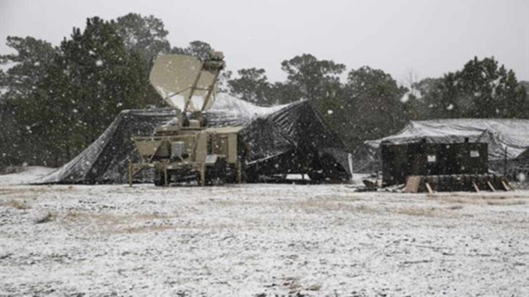 Snow falls over the command operations center during an entire day of a 2nd Marine Logistics Group command post exercise aboard Marine Corps Base Camp Lejeune, N.C., Feb. 24, 2015. The Marines involved in the CPX battled multiple weather conditions such as snow, sleet and rain during the exercise designed to ensure logistical readiness and identify areas in need of improvement. 