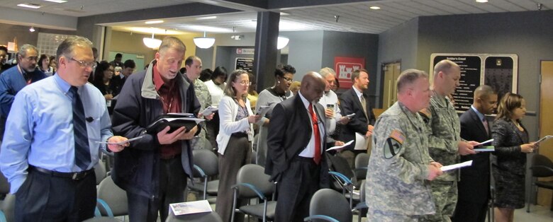 Huntsville Center employees sing the black national anthem, Lift Every Voice and Sing" during the 2015 Black History Month celebration. 