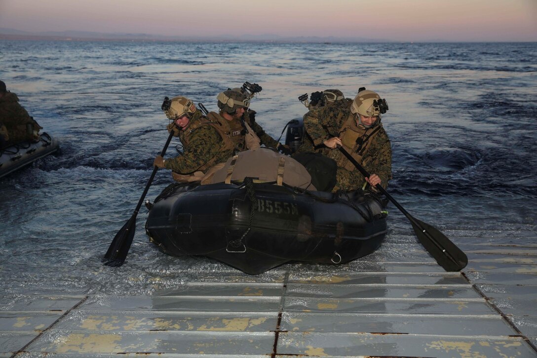 U.S. Marines with the 15th Marine Expeditionary Unit’s Maritime Raid Force disembark the USS Essex (LHD 2) during Amphibious Squadron/Marine Expeditionary Unit Integration Training (PMINT) off the coast of San Diego March 4, 2015. These Marines rode combat rubber raiding craft to a beach aboard Camp Pendleton, Calif., to execute a precision raid. (U.S. Marine Corps photo by Cpl. Anna Albrecht/Released)