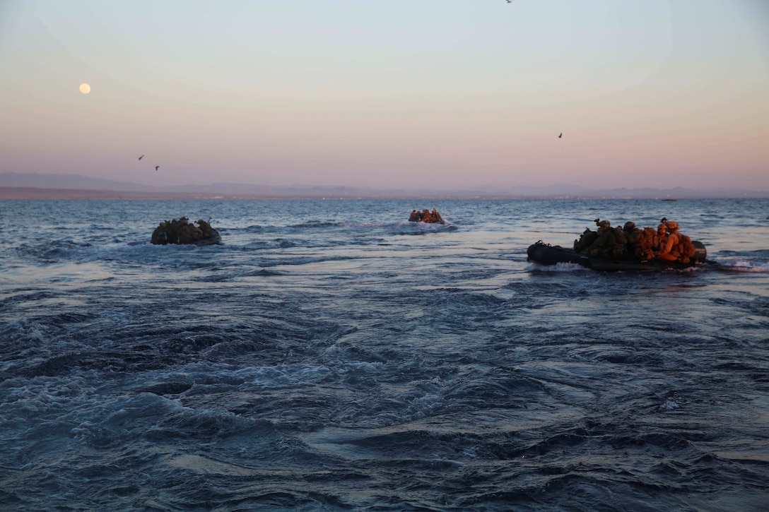 U.S. Marines with the 15th Marine Expeditionary Unit’s Maritime Raid Force disembark the USS Essex (LHD 2) during Amphibious Squadron/Marine Expeditionary Unit Integration Training (PMINT) off the coast of San Diego March 4, 2015. They loaded onto six combat rubber raiding craft to execute a precision raid aboard Camp Pendleton, Camp Pendleton, Calif. (U.S. Marine Corps photo by Cpl. Anna Albrecht/Released)