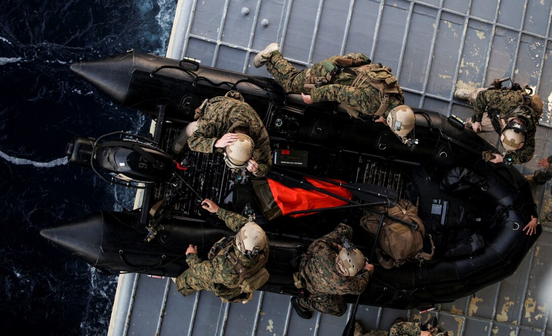 U.S. Marines with the 15th Marine Expeditionary Unit’s Maritime Raid Force prepare to depart USS Essex (LHD 2) on a combat rubber raiding craft during Amphibious Squadron Three/Marine Expeditionary Unit Integration Training (PMINT) off the coast of San Diego March 4, 2015. The MRF used CRRCs during a precision raid exercise in preparation for their deployment later this spring. (U.S. Marine Corps photo by Cpl. Elize McKelvey/Released)