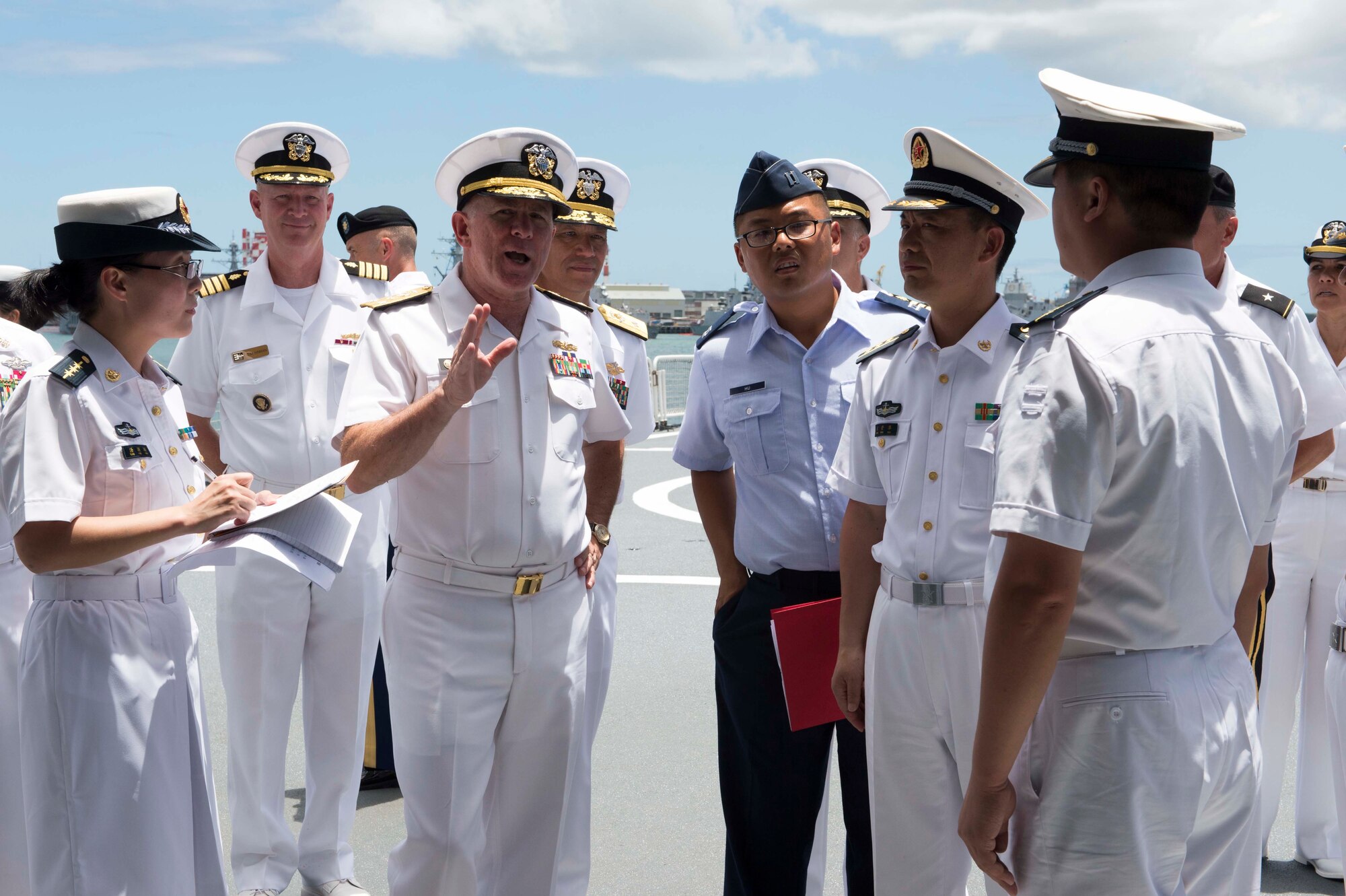Capt. Joshua Hu, center, looks on during an official visit to the People’s Liberated Army navy hospital ship, the ARK PEACE, by the Pacific Command surgeon general and staff during Rim of the Pacific 2014. This was the first time Chinese ships participated in RIMPAC, the largest maritime exercise in the world. (Photo courtesy of Capt. Joshua Hu)