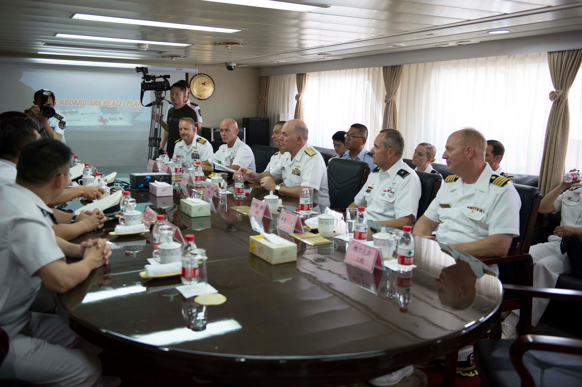 Capt. Joshua Hu, center back row, looks on during an official visit to the People’s Liberated Army navy hospital ship, the ARK PEACE, by the Pacific Command surgeon general and staff during Rim of the Pacific 2014. This was the first time Chinese ships participated in RIMPAC, the largest maritime exercise in the world. (Photo courtesy of Capt. Joshua Hu)