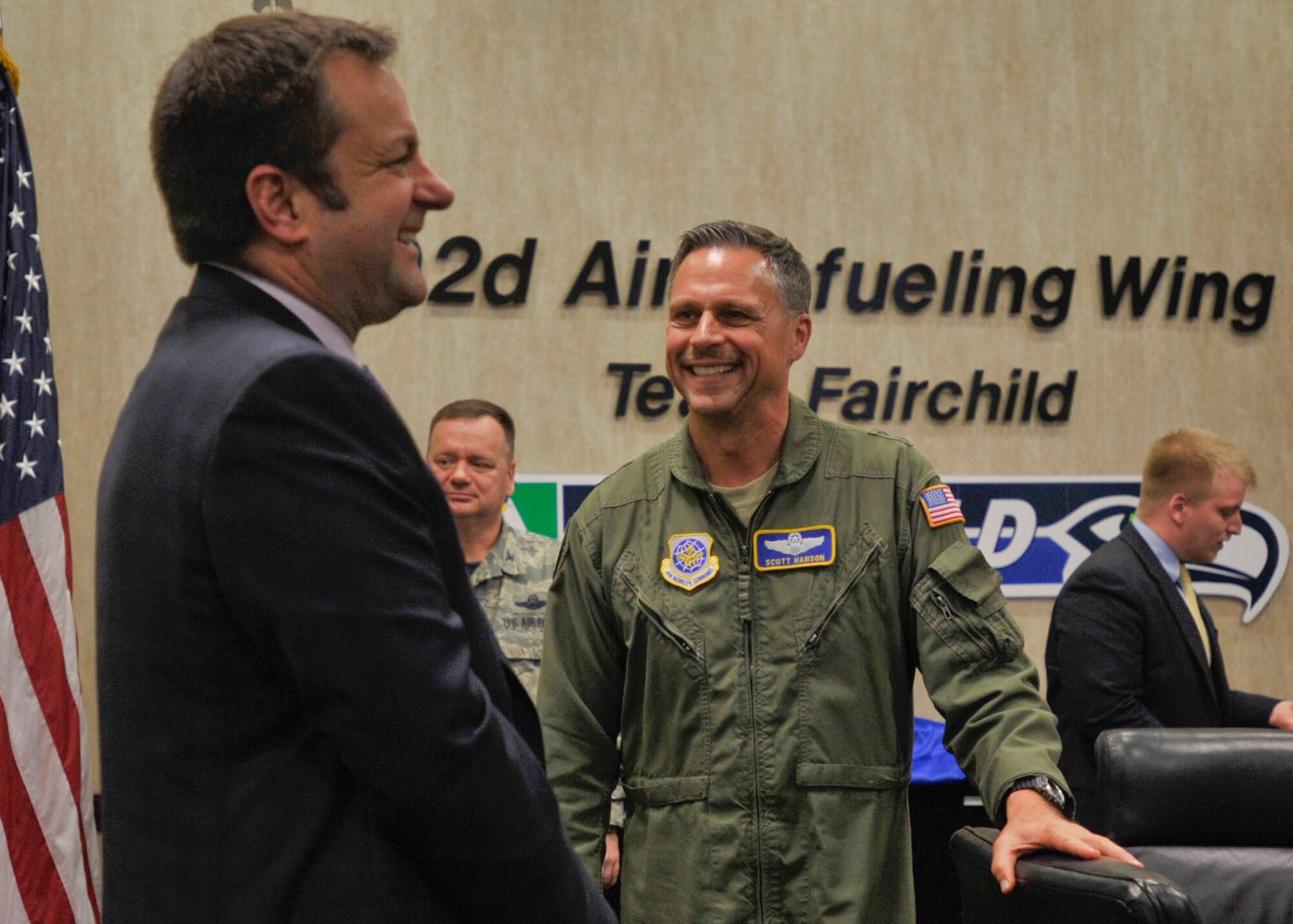 Maj. Gen. Scott Hanson, Director of Operations, Headquarters Air Mobility Command, speaks with Chud Wendle, District Director for Congresswoman Cathy McMorris Rodgers March 6, 2015, at Fairchild Air Force Base, Wash. Hanson met with Washington State congressional and senate staff members to discuss the Air Mobility Command mission as well as other topics. Hanson was a previous 92nd Air Refueling Wing commander from 2005-2007.