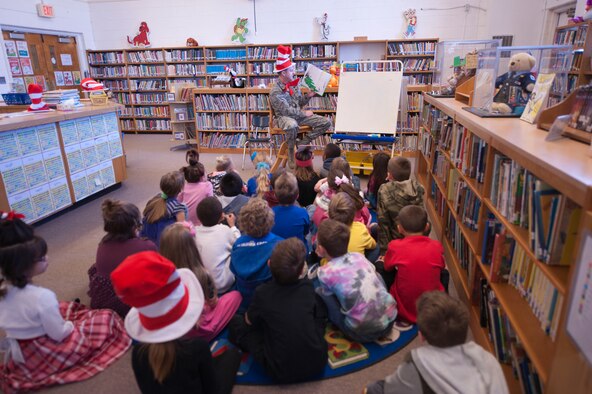 Col. Robert Kiebler, 49th Wing commander, reads ‘Yertle the Turtle’ to a class of second grade students at Holloman Elementary School, March 6, at Holloman Air Force Base, NM. The National Education Association designated Read Across America as a week-long celebration of reading in honor of Dr. Seuss’s birthday and the fact he was one of the biggest advocates of reading. (U.S. Air Force Photo by Staff Sgt. E’Lysia A. Wray/Released)