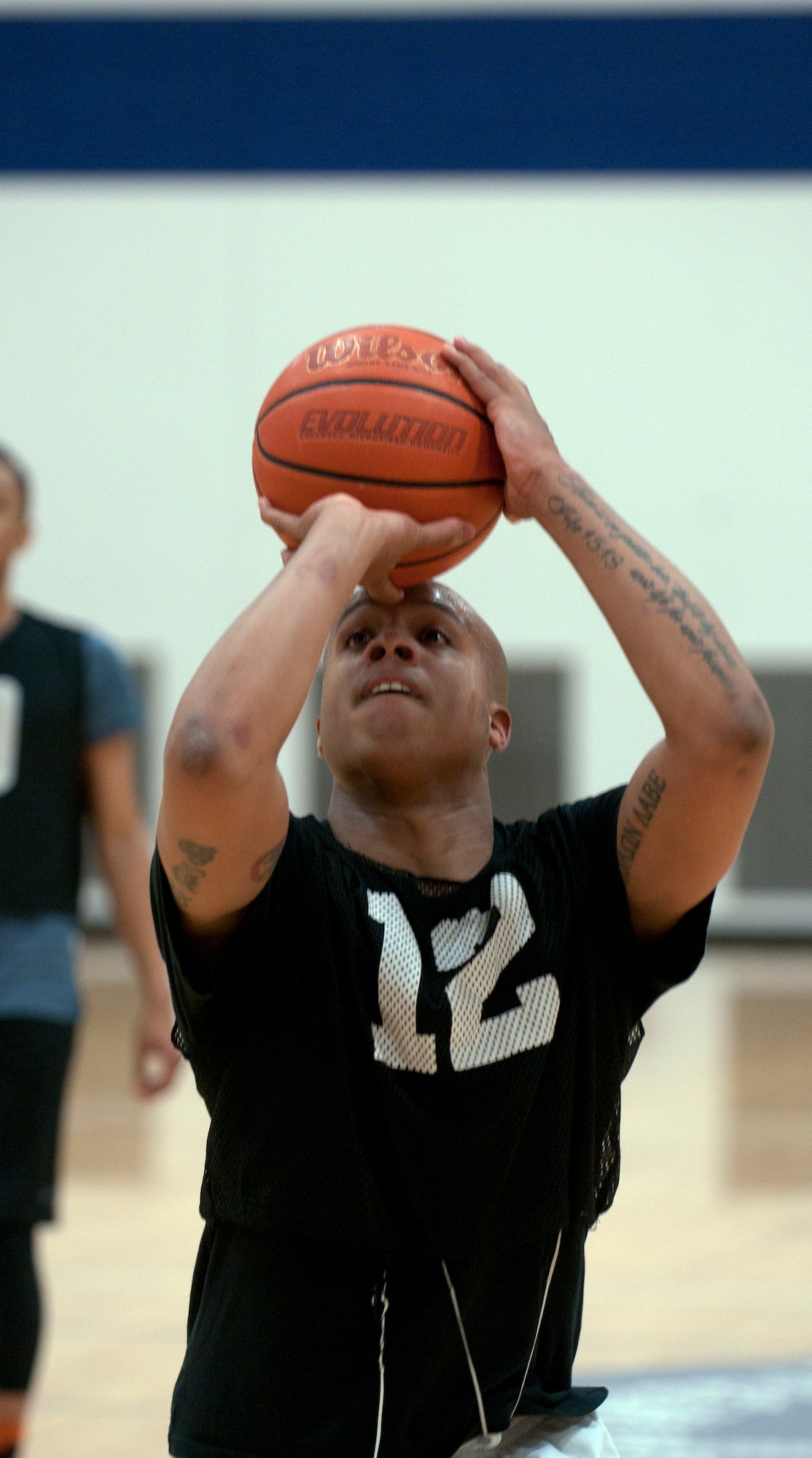 Destry Mays, 90th Security Forces Group Basketball team member, aims for a free-throw shot during the 2015 Intramural Basketball Game March 4, 2015, in the Freedom Hall Fitness Center on F.E. Warren Air Force Base, Wyo. The 90th SFG team won the championship game with a score of 58 against the 90th FSS team who scored 49. (U.S. Air Force photo by Airman 1st Class Malcolm Mayfield)