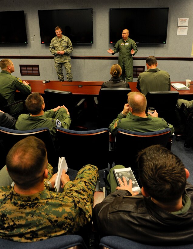 Brig. Gen. Thomas Deale, Air Combat Command director of operations, Joint Base Langley-Eustis, Va. and Brig. Gen. Giovanni Tuck, Air Force director of operations and deputy chief of staff for operations, plans and requirements, Washington D.C., address Air Force, Army, Navy and Marine members during a morning briefing as part of the Future Close Air Support Focus Week March 4, at the Pentagon. (U.S. Air Force photo/Tech. Sgt. Anthony Nelson Jr.) 