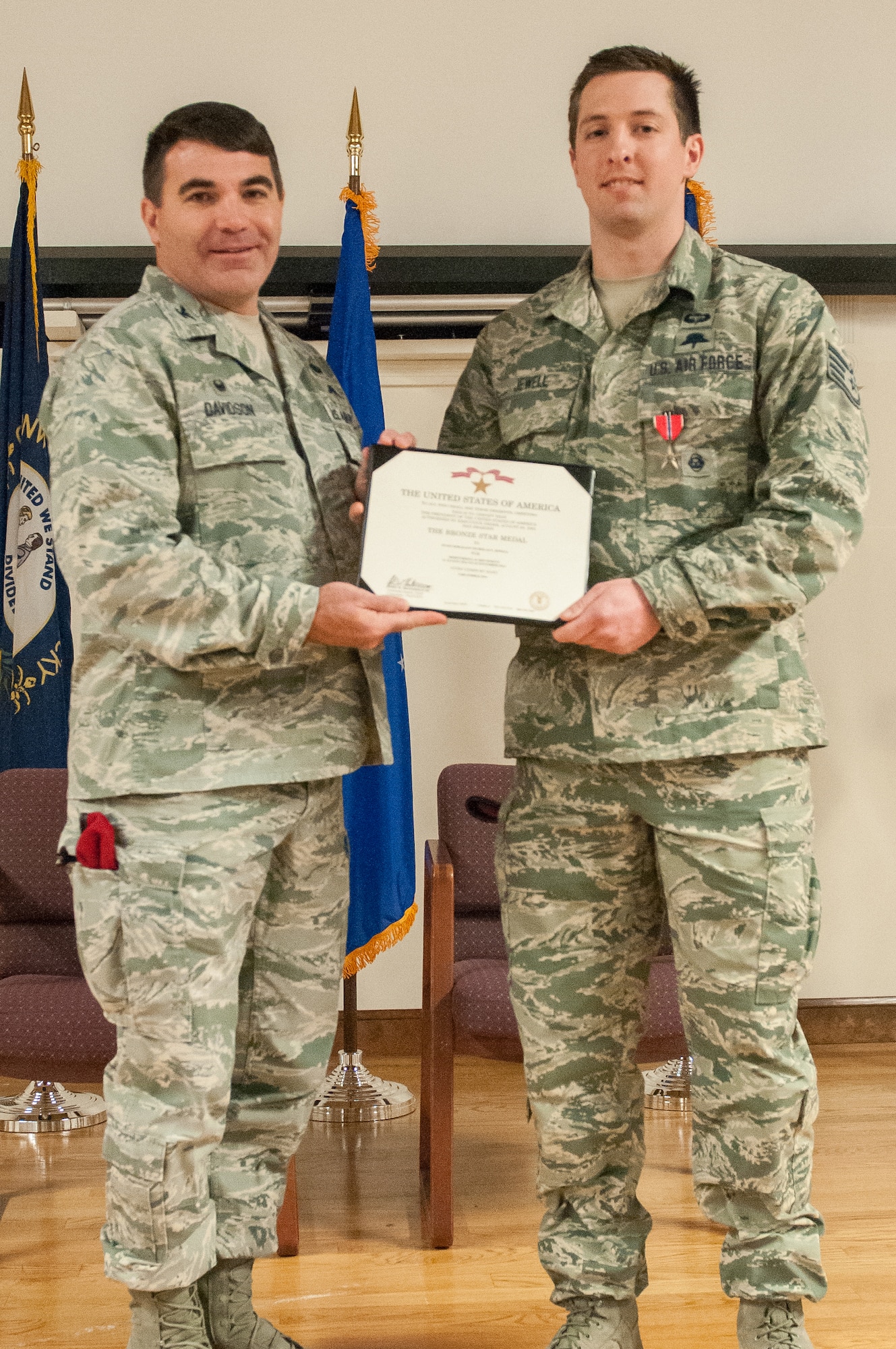 Col. Matthew Davidson (left), commander of the 24th Special Operations Wing, presents Staff Sgt. Nicholas P. Jewell, a combat controller in the Kentucky Air National Guard’s 123rd Special Tactics Squadron, with the Bronze Star Medal during a ceremony Feb. 7, 2015, at the Kentucky Air National Guard Base in Louisville, Ky. Jewell earned the award for meritorious achievement while supporting Operation Enduring Freedom in Afghanistan in 2014. (U.S. Air National Guard photo by Staff Sgt. Vicky Spesard)