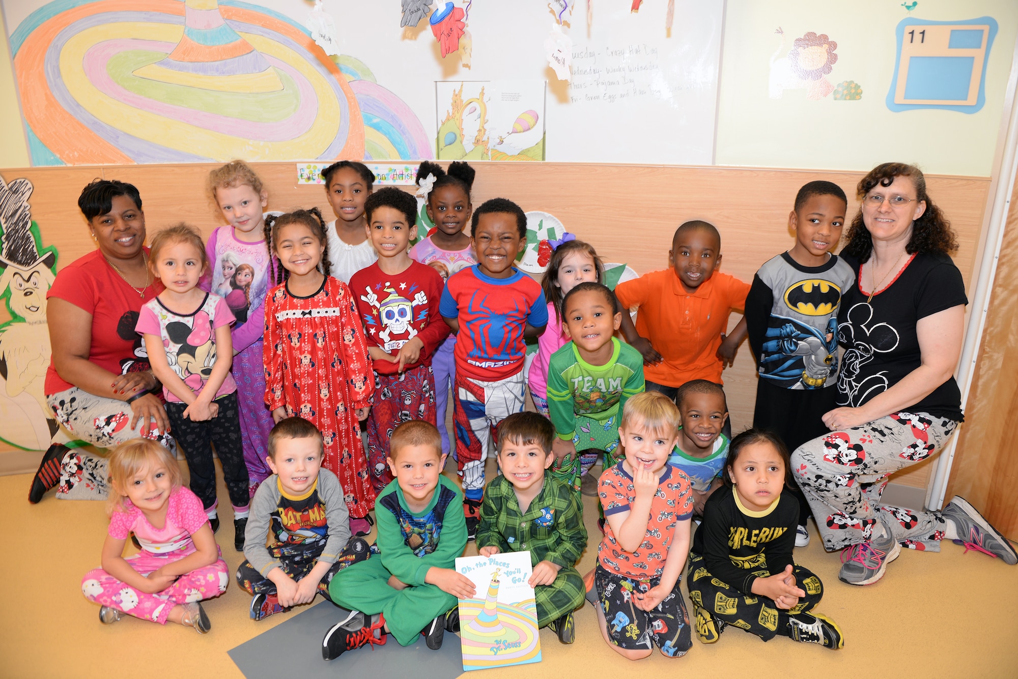 Donna Petty and Pam Lewis, Child Development Center II staff members, show Pajama Day pride with the Pre-K class to celebrate Dr. Seuss week March 5, 2015, at Moody Air Force Base, Ga. The CDC and base youth programs dedicated a week to Dr. Seuss with assigned themes every day.  (U.S. Air Force photo by Airman Greg Nash/Released)