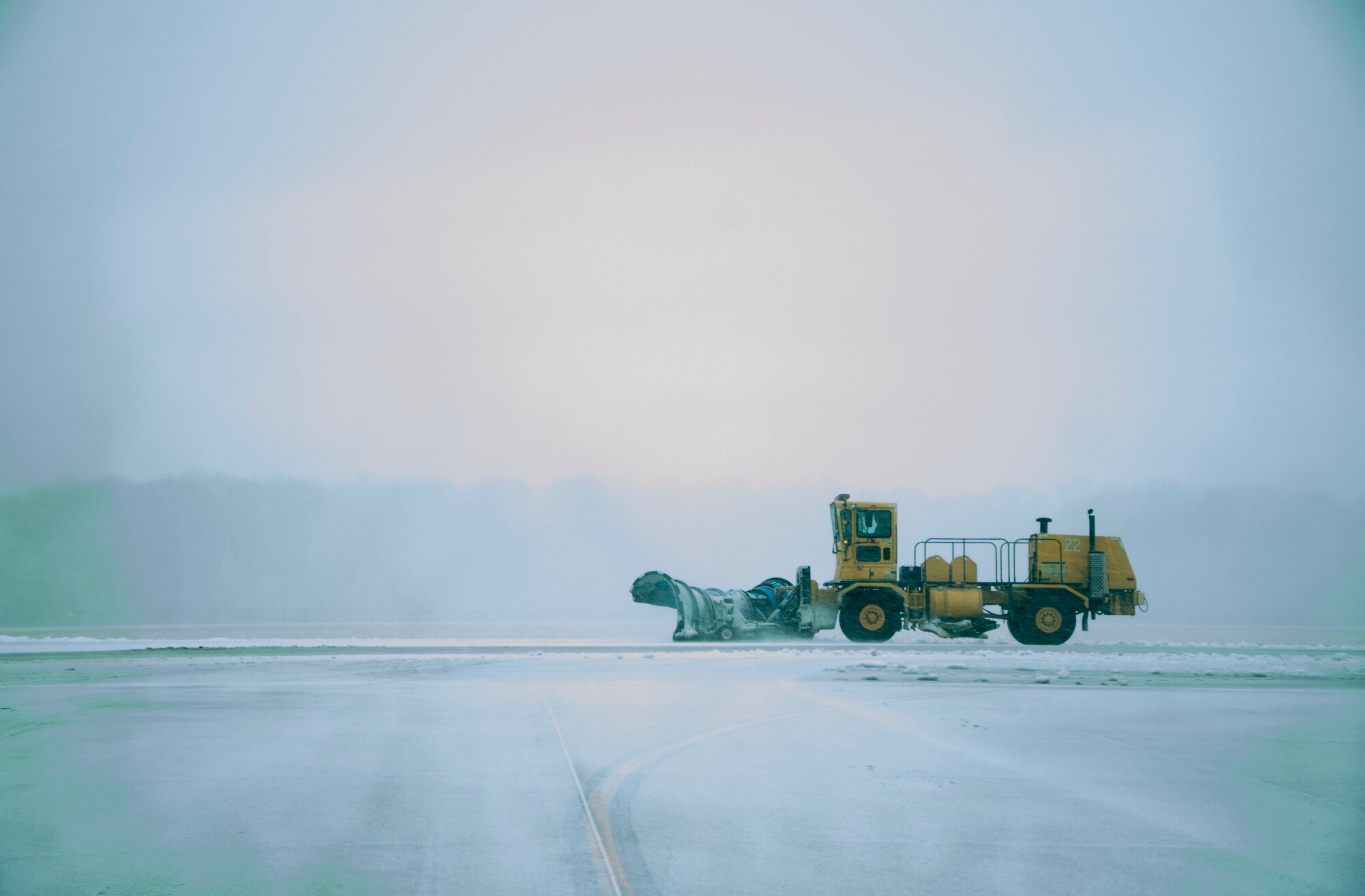 A view from inside a vehicle of a plow clearing the runway during a snow storm March 5, 2015, at Dover Air Force Base, Del. Dover received six inches of snow during the storm with a low temperature of 21 degrees Fahrenheit. (U.S. Air Force photo/Senior Airman Jared Duhon)