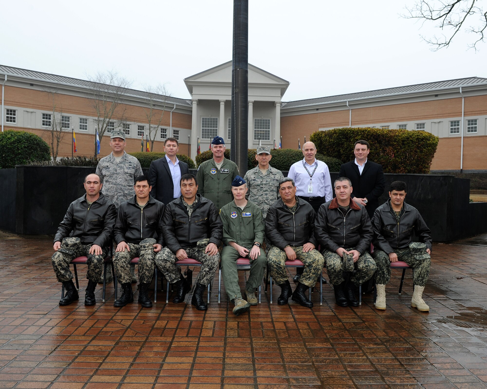 Members of the Uzbekistan air force pose for a photo with Columbus Air Force Base senior leaders March 3 outside of the Wing Headquarters building. The Uzbekistan troops came here to get a first-hand experience in how they could structure their own pilot training program. (U.S. Air Force photo/Elizabeth Owens)