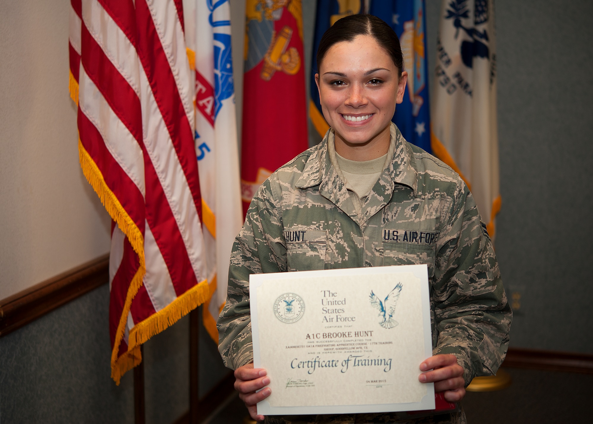 GOODFELLOW AIR FORCE BASE, Texas -- Airman 1st Class Brooke D. Hunt, 177th Fighter Wing New Jersey Air National Guard firefighter, poses for a photo after graduating from the Fire Protection Apprentice Course at the Louis F. Garland Department of Defense Fire Academy March 4. (U.S. Air Force photo/ Airman 1st Class Devin Boyer)