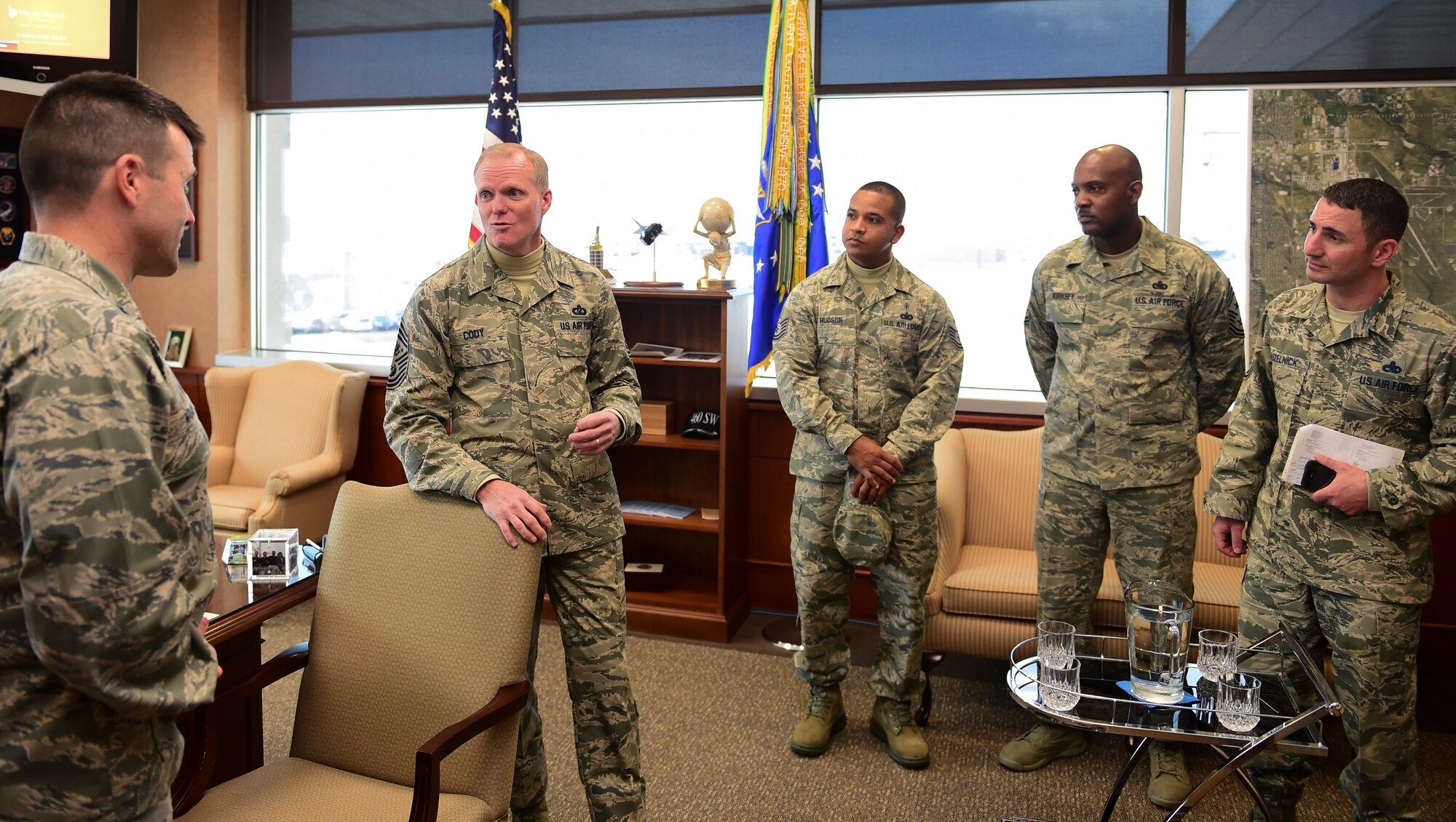 Chief Master Sgt. of the Air Force James A. Cody engages with Col. John Wagner, 460th Space Wing commander during a visit March 5, 2015, at Buckley Air Force Base, Colo. Cody visited Buckley to visit with Airmen and better understand the base mission.. (U.S. Air Force photo by Airman 1st Class Luke W. Nowakowski/Released)