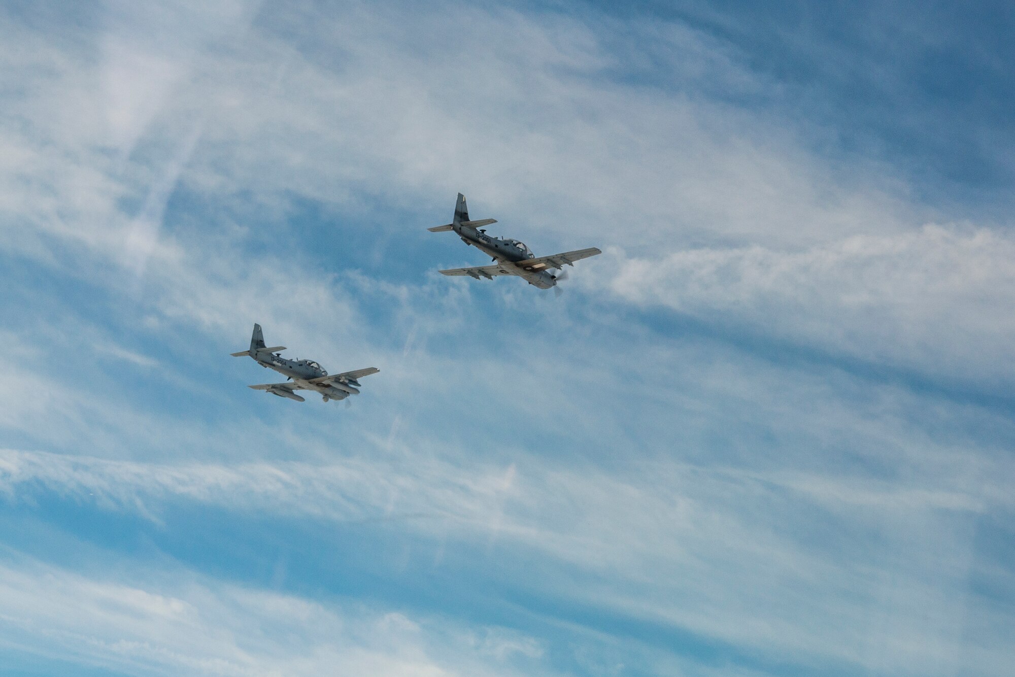 Two A-29 Super Tucanos from the 81st Fighter Squadron fly in formation March 5, 2015, in the skies over Moody Air Force Base, Ga. The formation was the first time an Afghan Air Force student pilot flew while assigned to the 81st FS. (U.S. Air Force Photo by Senior Airman Ryan Callaghan/Released)