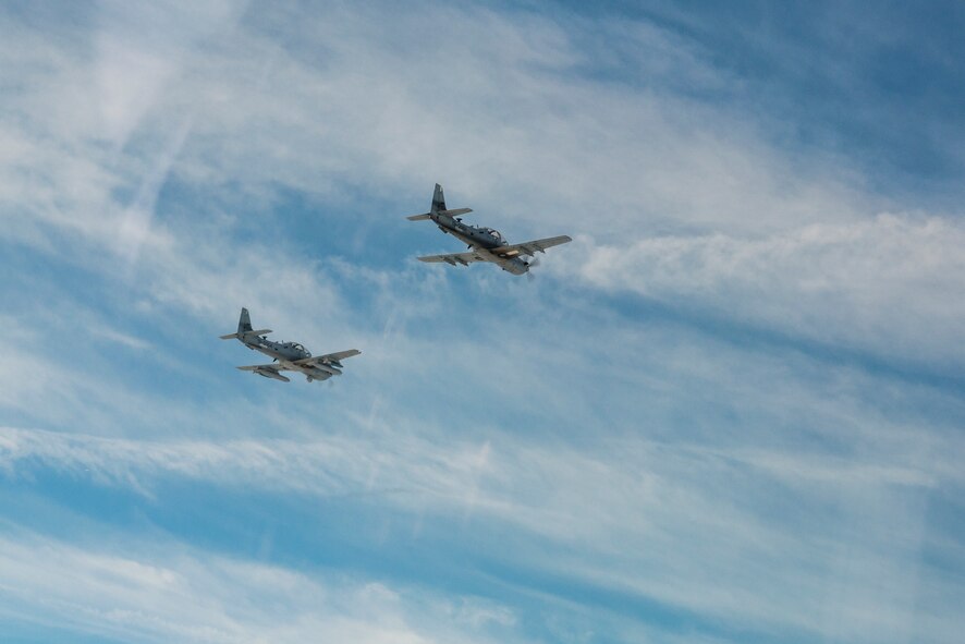 Two A-29 Super Tucanos from the 81st Fighter Squadron fly in formation March 5, 2015, in the skies over Moody Air Force Base, Ga. The formation was the first time an Afghan Air Force student pilot flew while assigned to the 81st FS. (U.S. Air Force Photo by Senior Airman Ryan Callaghan/Released)