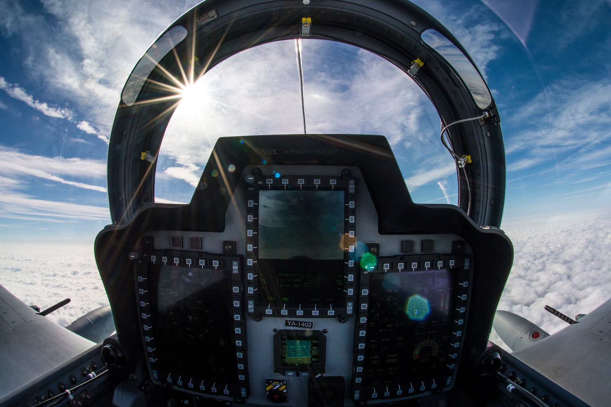 The sun illuminates the rear cockpit of an A-29 Super Tucano during flight March 5, 2015, in the skies over Moody Air Force Base, Ga. The 81st Fighter Squadron is using the aircraft to train Afghan Air Force pilots and maintainers. (U.S. Air Force Photo by Senior Airman Ryan Callaghan/Released)
