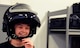 Gage Baska, a 14 year-old resident of Blue Springs, Mo., straps on an explosive ordinance disposal helmet at Whiteman Air Force Base, Mo., Nov. 5, 2014. Baska had an opportunity to tour the EOD training area and learn about various functions of the career field as part of an intervention program he is participating in. (U.S. Air Force photo by Staff Sgt. Nick Wilson/Released)