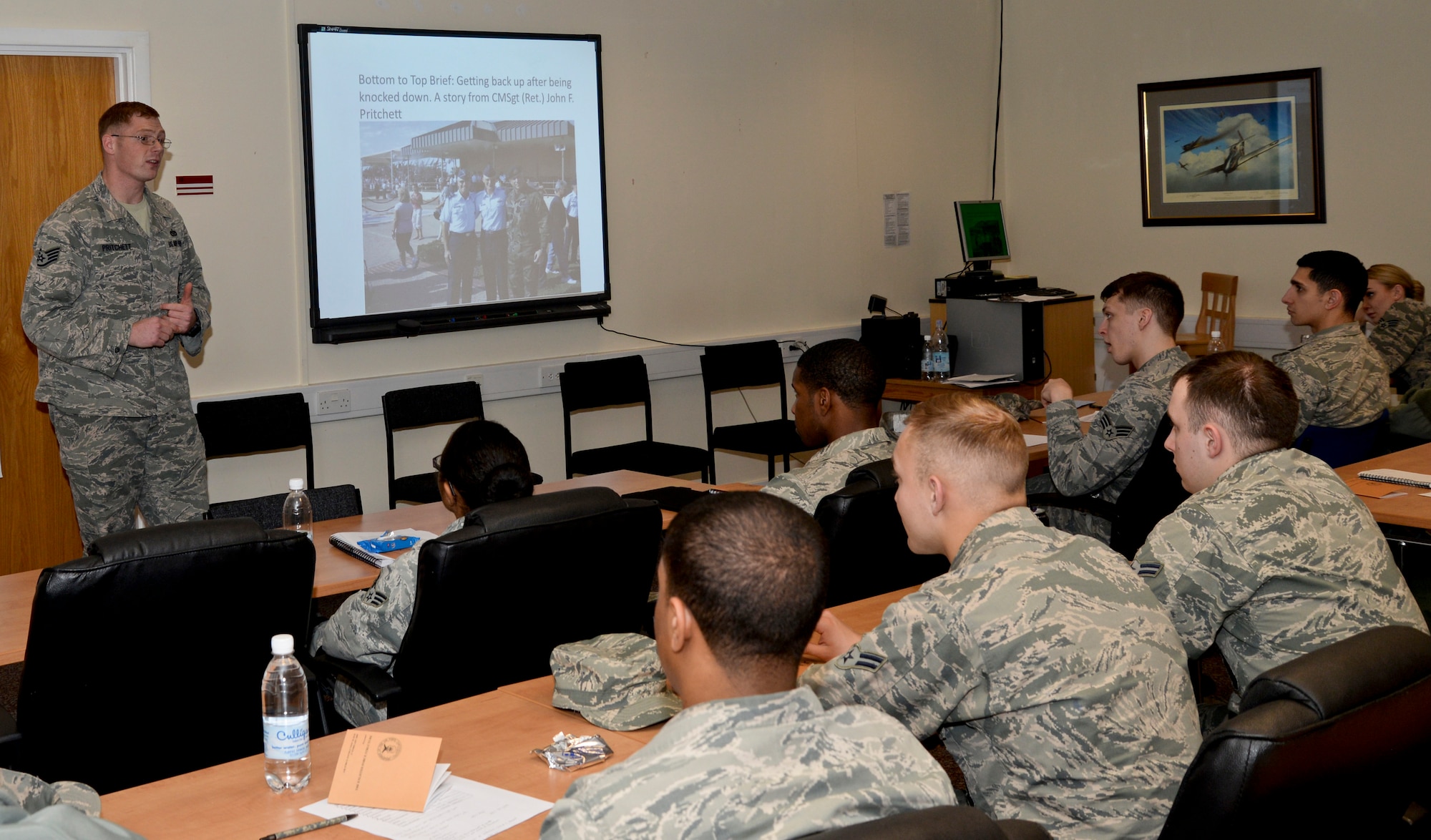U.S. Air Force Staff Sgt. William Pritchett, second from left, 100th Civil Engineer Squadron firefighter from San Antonio, speaks to Airmen during a Junior Enlisted Professional Enhancement Seminar March 2, 2015, at the Professional Development Center on RAF Mildenhall, England. Pritchett emphasized the importance of being an outstanding Airman, even during tough times. During the seminar, several NCOs spoke with junior service members on tips and suggestions of being such Airmen. (U.S. Air Force photo by Airman 1st Class Jonathan Light/Released)