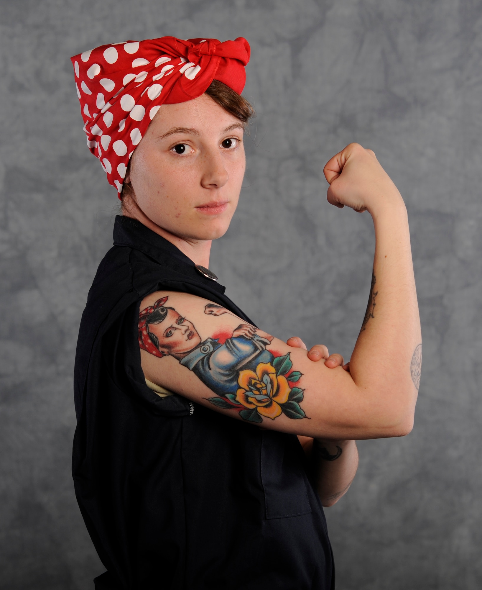 Staff Sgt. Alexandra M. Longfellow, 509th Bomb Wing Public Affairs photojournalist, displays a tattoo of “Rosie the Riveter” to showcase how she became who she is today. The history of “Rosie” shows that with dedication and effort, anyone can do anything. Many women opted to take on male-dominated trades to support their families while their husbands fought in World War II, an era in which they typically held positions as housewives. (U.S. Air Force photo by Staff Sgt. Alexandra M. Longfellow/Released)