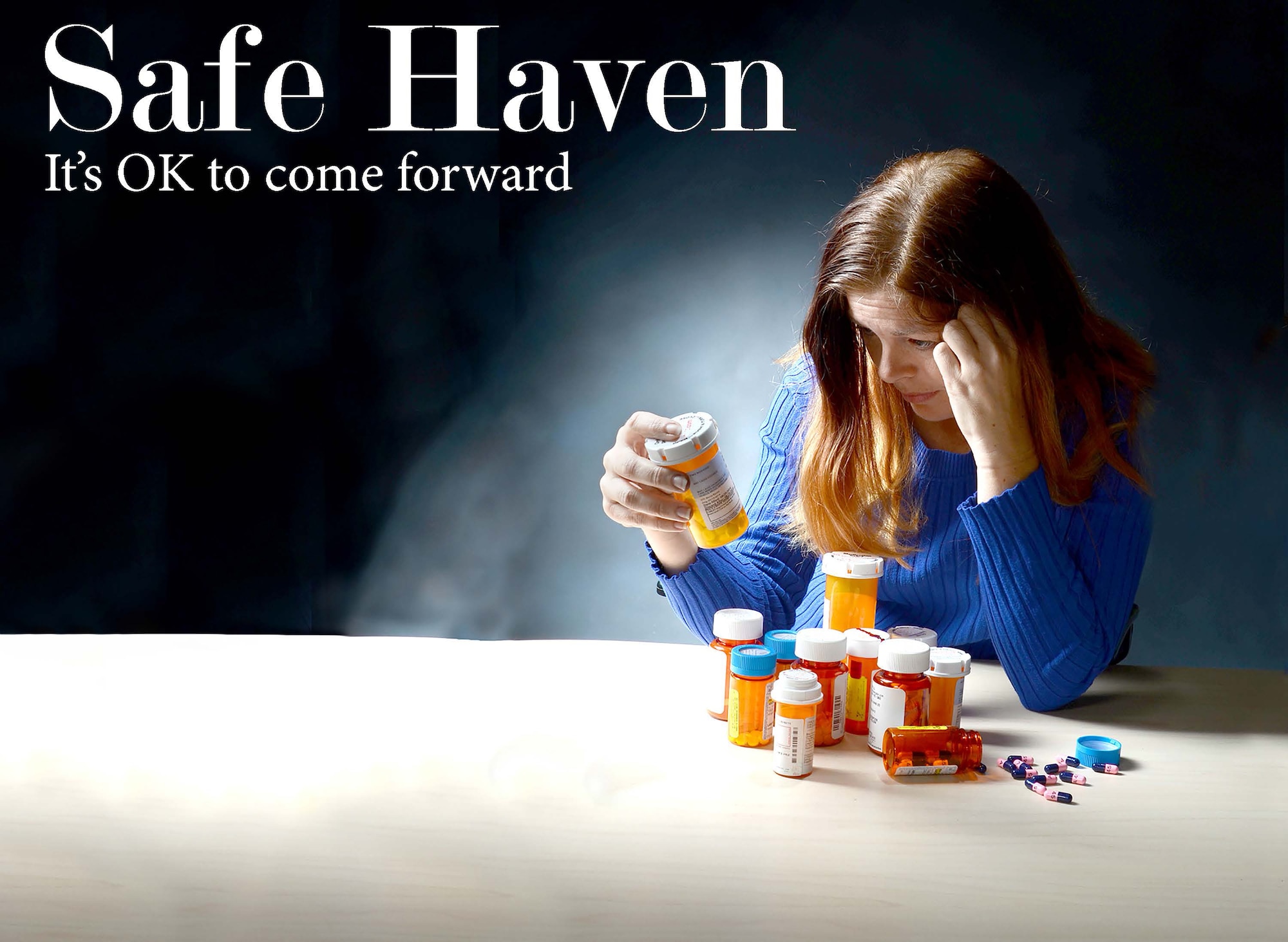 To best represent the struggles that go along with substance abuse problems, Robins Public Affairs photographer Tommie Horton asked Angela Woolen, Rev-Up reporter, to model for the photo illustration used on the front page of the base newspaper. Although prescription drugs were used for the illustration, all substance abuse problems are serious, and help is available. (U.S. Air Force photo illustration by Tommie Horton)

