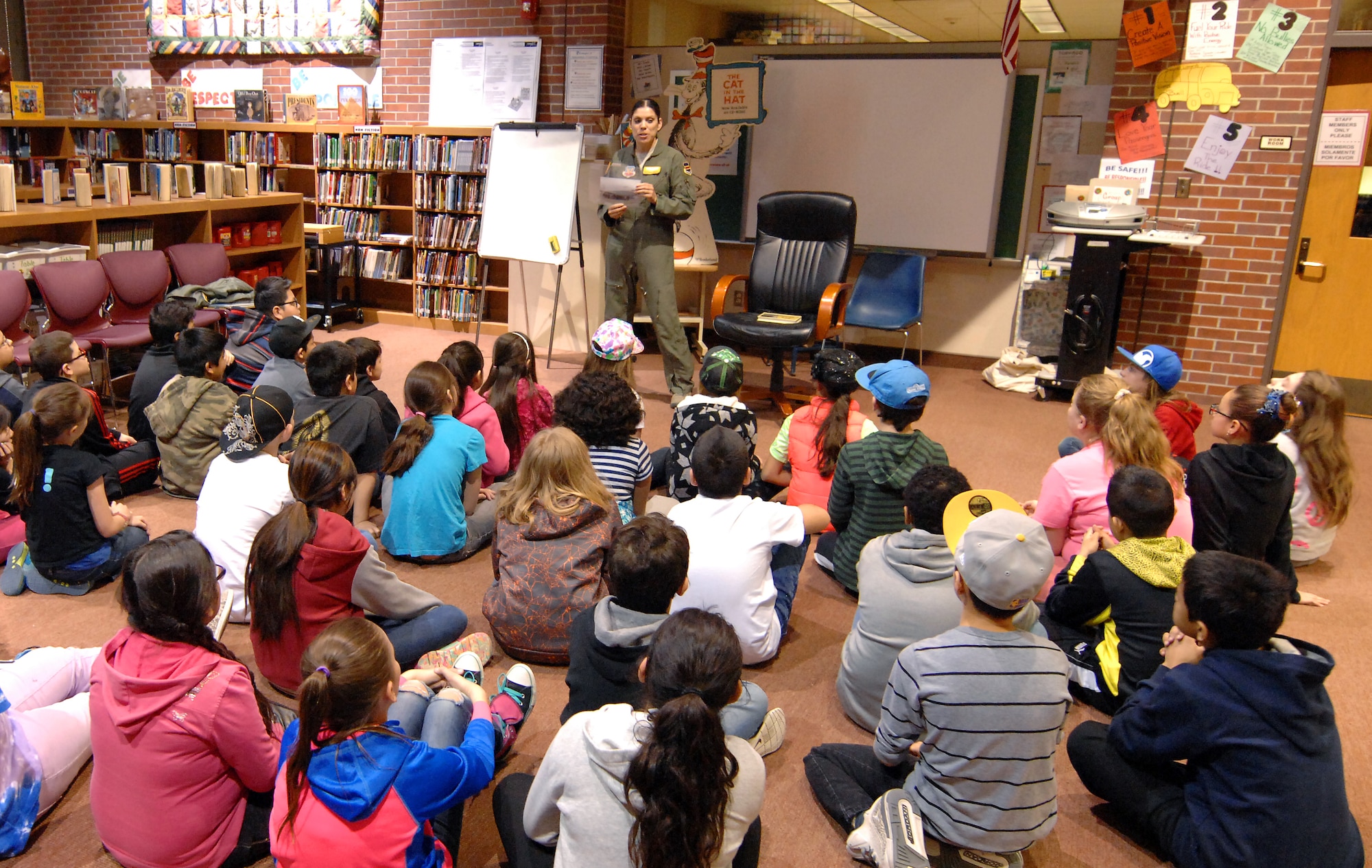 U.S. Air Force Tech. Sgt. Elena Lawmaster answers questions from third grade students at Bancroft Elementary School in Omaha, Neb. March 3 as part of the ‘Read Across America’ program. Lawmaster, who is a sensor maintenance technician assigned to the 45th Reconnaissance Squadron at Offutt Air Force Base, Neb., read to the students and discussed how reading can help you achieve higher goals. (U.S. Air Force photo by Delanie Stafford)