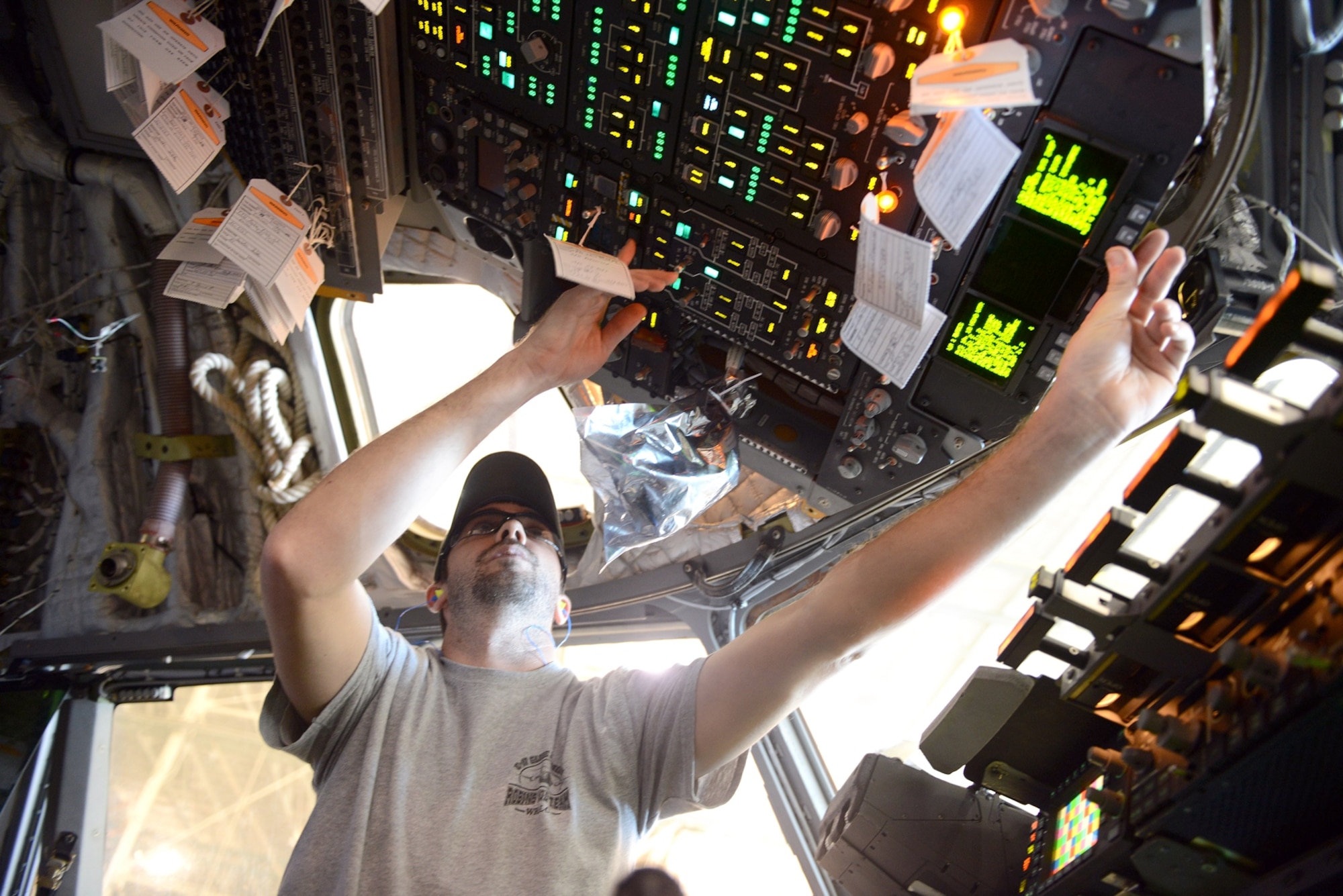 Rob Haymons, 562nd Aircraft Maintenance Group aircraft electrician, performs operational checks of C-17 interior light panels. (U.S. Air Force photo by Tommie Horton)