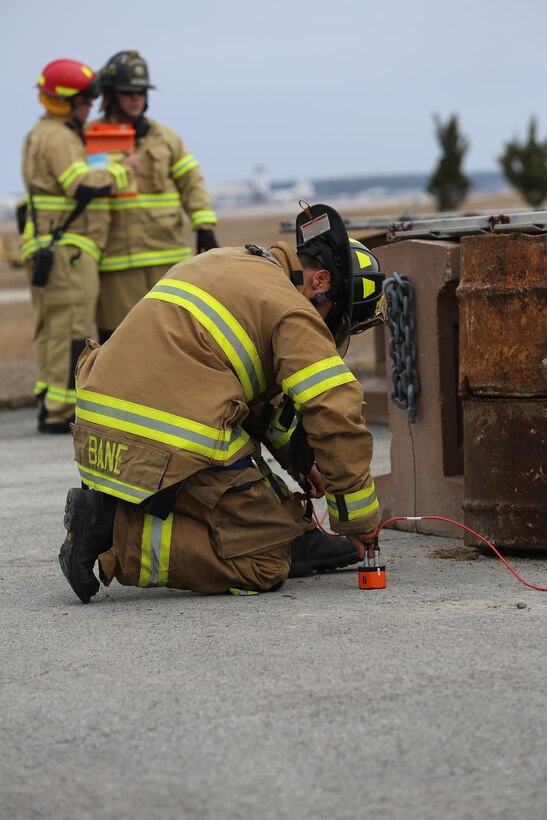 Raymond Bane connects a Delsar Life Detector Listening Device to listen for survivors inside the rubble following a simulated vehicle borne IED explosion during the 2015 Crisis Response Drill at Marine Corps Air Station Cherry Point, N.C., March 3, 2015.  The annual exercise was designed to test Cherry Point’s emergency preparedness program and response procedures. Bane is a firefighter with Cherry Point’s Fire and Emergency Services Department.