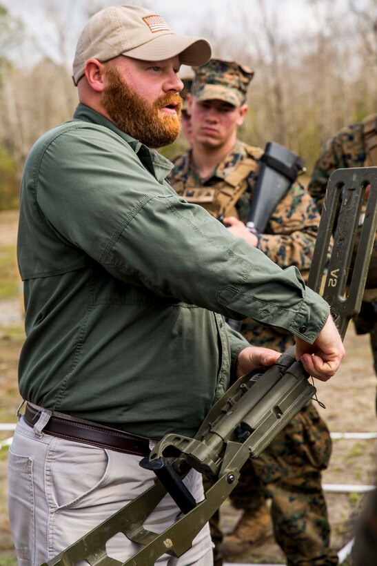 Paul Albaugh, a training specialist with Marine Corps Engineer School, explains the different settings and functions of the Compact Metal Detector during the practical application portion of a week-long Counter-IED course aboard Camp Lejeune, N.C., March 2-5, 2015. Albaugh said that CIED is essential to 2nd CEB’s mission accomplishment because IED’s aren’t just centralized to Afghanistan, but are a global threat and will continue to be a global threat; having effective tactics, techniques and procedures in place is important. (U.S. Marine Corps photo by Cpl. Krista James/Released)