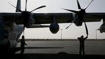 U.S. Marine aircraft crewmen with Marine Aerial Refueler Transport Squadron 352, Special Purpose Marine Air Ground Task Force – Crisis Response – Central Command, perform pre-flight checks on a KC-130J Hercules aircraft before takeoff in the Central Command area of operations, Feb. 23, 2015. The Marines, sailors and aircraft with VMGR 352 support SPMAGTF – CR – CC by transporting supplies, equipment, and personnel to various locations in the region. 